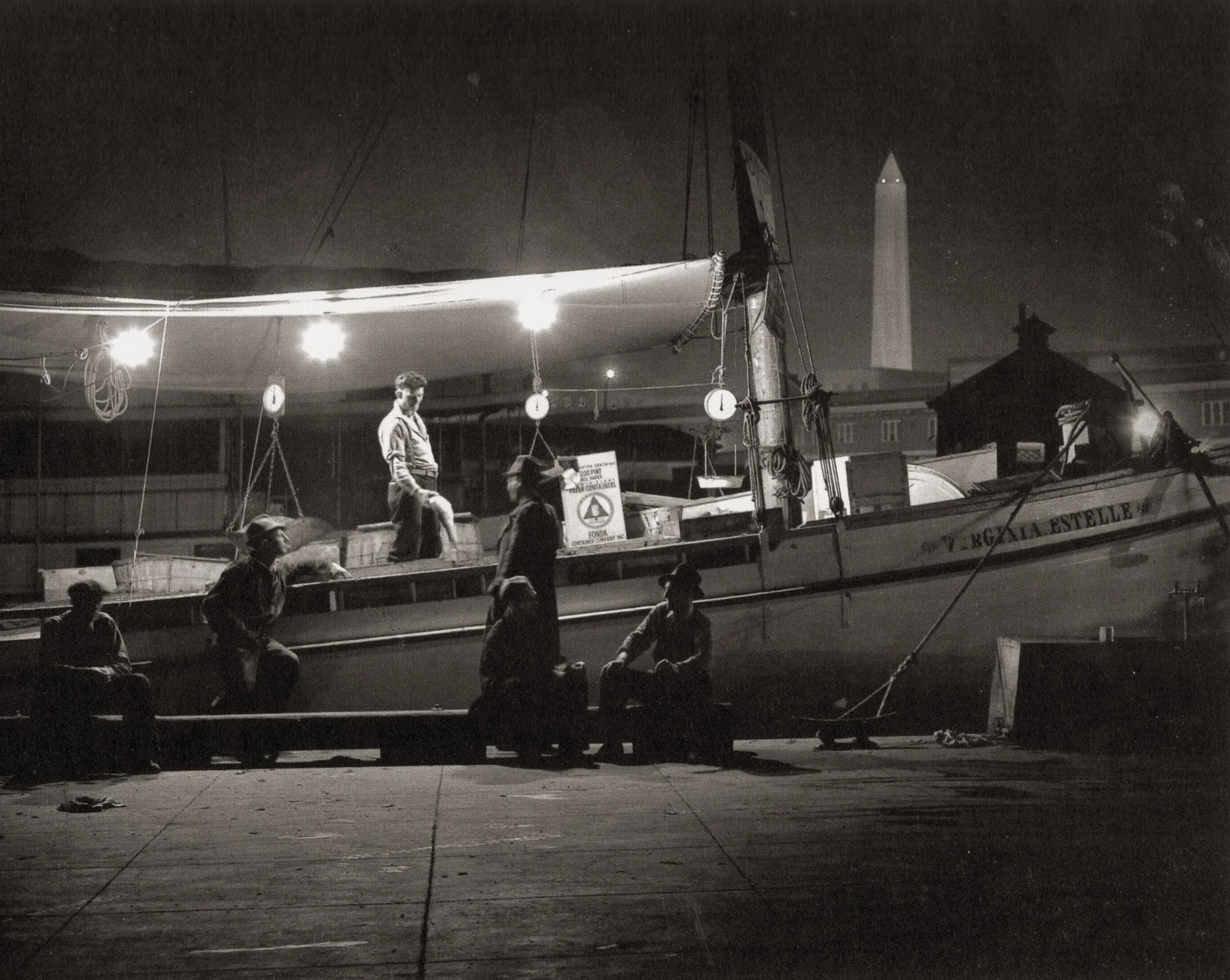 “The Waterfront.” The Washington canal was where fishermen delivered and sold their catch from the Chesapeake Bay to the restaurants and wealthy homes of Washington, D.C. In this image, a fisherman shows his catch to a customer in the shadow of the Washington Monument.