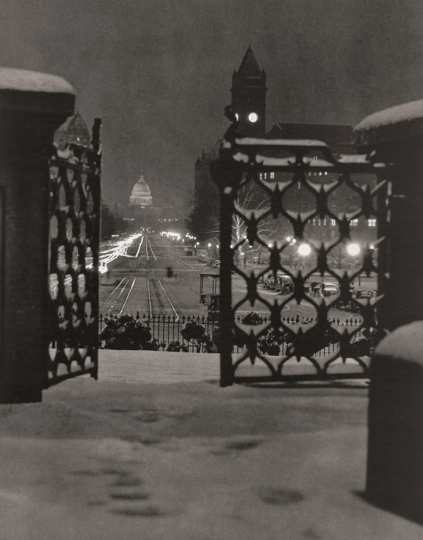 “Pennsylvania Avenue.” An image made on a snowy night from behind the gates of the Treasury building to the Capitol. Note the reflections off of the street car tracks, and the trails from car headlights, but not tail lights. Perhaps tail lights didn’t yet exist in the 1930s, or they were so dim as to not register on Wentzel’s film. The tower on the right is the old post office.