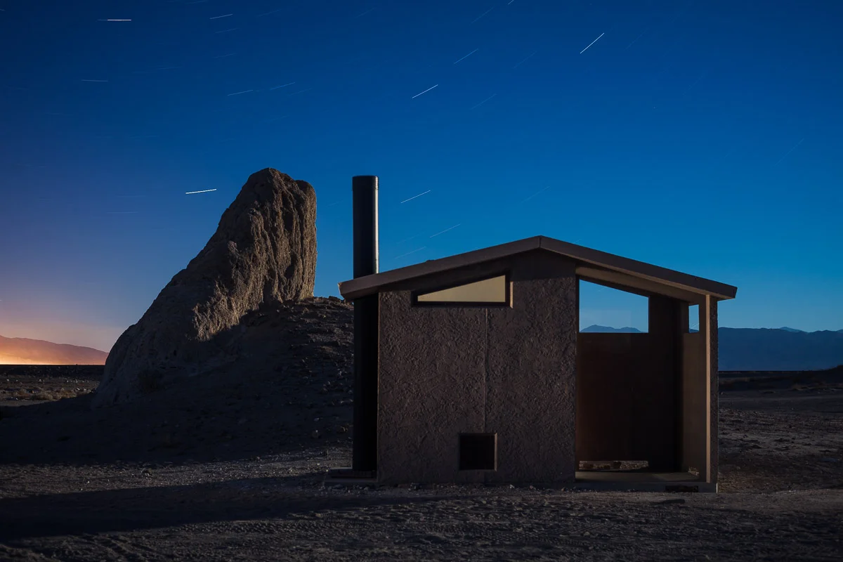 The final attempt. 10 minutes, f/4, ISO 100. Canon 5D Mark II with an Olympus Zuiko Shift 35mm f/2.8 lens. A few seconds from camera-far-left with a Surefire P6 incandescent flashlight to show texture in the structure. I used the same light for a few seconds inside the loo, bounced off the front wall. The light on the rock and the vent pipe was ambient that accumulated during the long exposure. The color of the sky is so different due to the combination of the long exposure and the moonlight’s effect on the white balance.