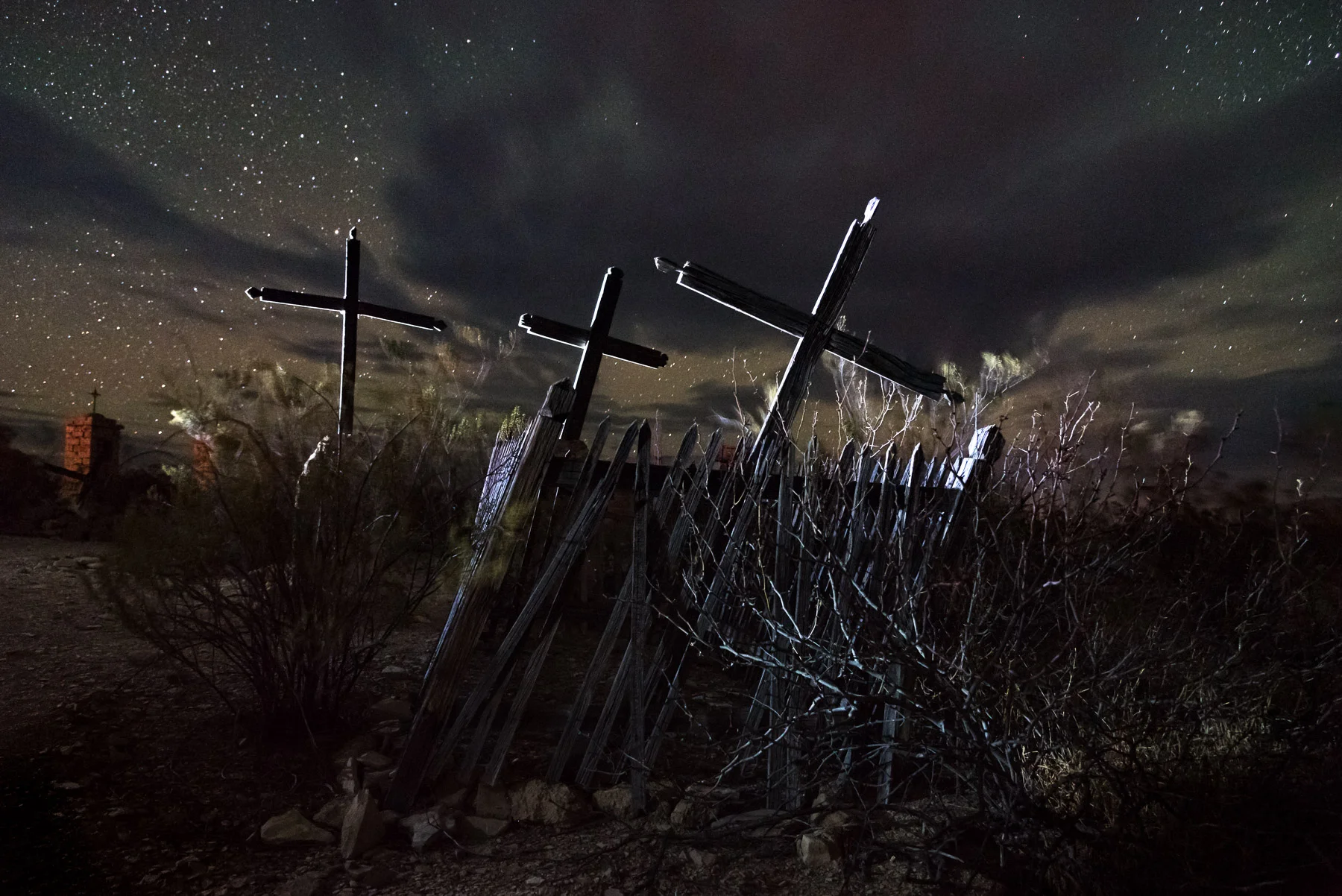 The 2016 image was shot on a moonless night with fast-moving clouds in April, with Coast HP5R backlighting from camera left and a brief pop of bounced light in front of the fence with the same light source. Atmospheric conditions and added lighting make these two images of the same subject completely different. Nikon D750, Nikon 24-120mm f/4 lens at 24mm. 30 seconds, f/4.5, ISO 6400.