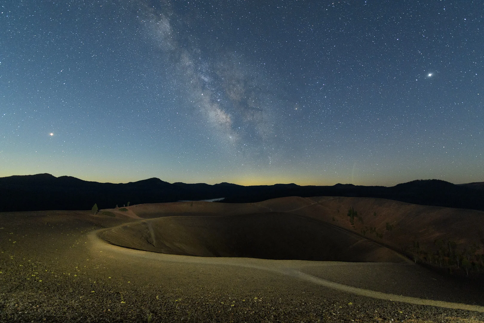 In Lassen Volcanic National Park , Lance and I used a pair of Luxli Viola panel lights to illuminate Cinder Cone, which is approximately 1,000 feet in diameter. We were relatively far away from our giant subject with relatively dim illumination. We could barely see where the light was hitting, but over the course of a 15-second exposure at a high ISO, that little bit of light was enough to do the job. Nikon D5 and 14-24mm f/2.8 lens. 15 seconds, f/3.2, ISO 6400. Photo © 2018 Chris Nicholson.