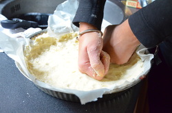 3. Place parchment paper in your pan and add in crust mixture. Start to mold mixture into the pie pan with your hands. Freeze for 30 mins and preheat oven to 140C/ 280F 