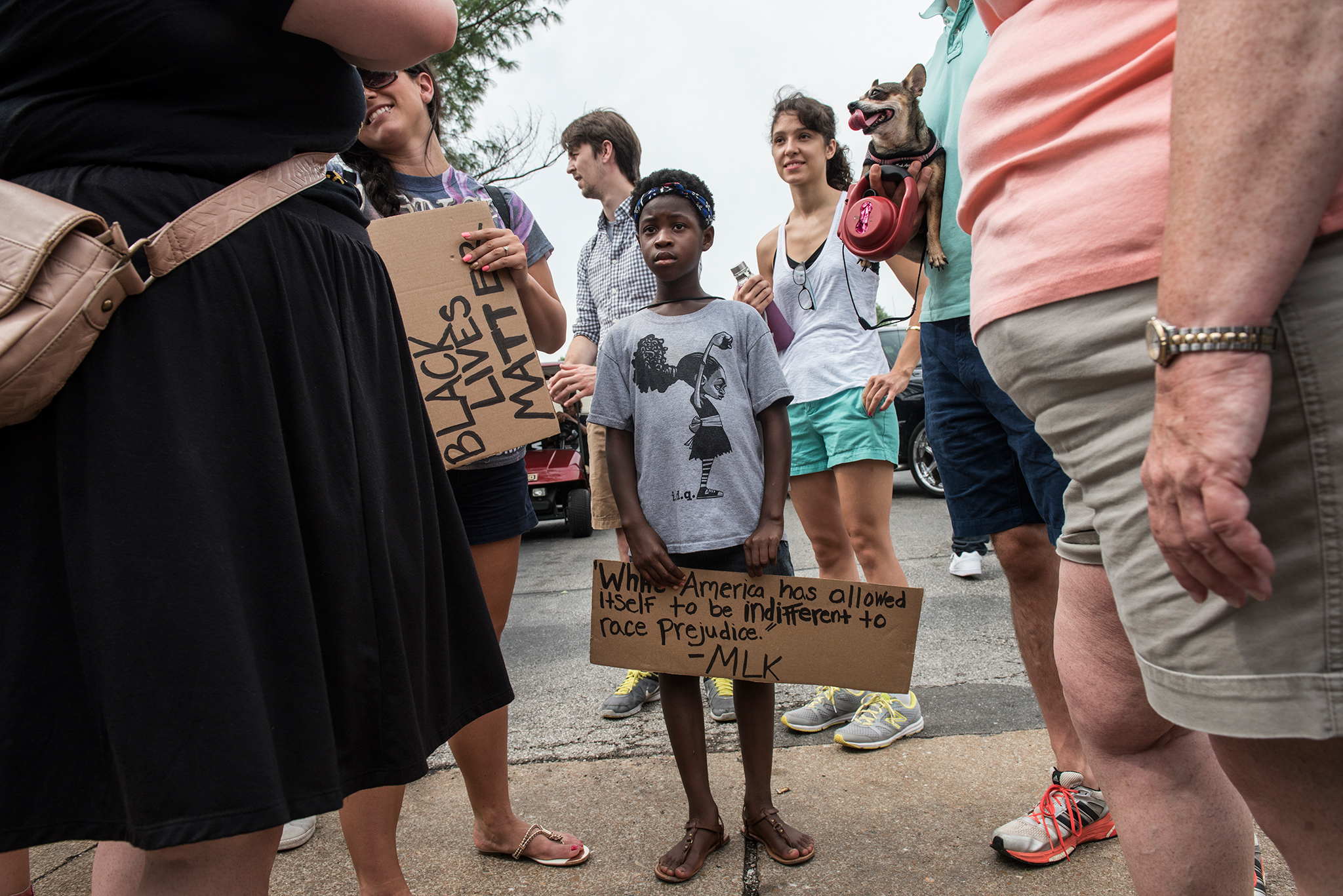 Family, friends, activists and protesters gather on the site where Michael Brown was fatally shot in Ferguson, Missouri on August 9, 2015, to commemorate the first anniversary of his death and to participate in a larger conversation about race and policing in the United States.