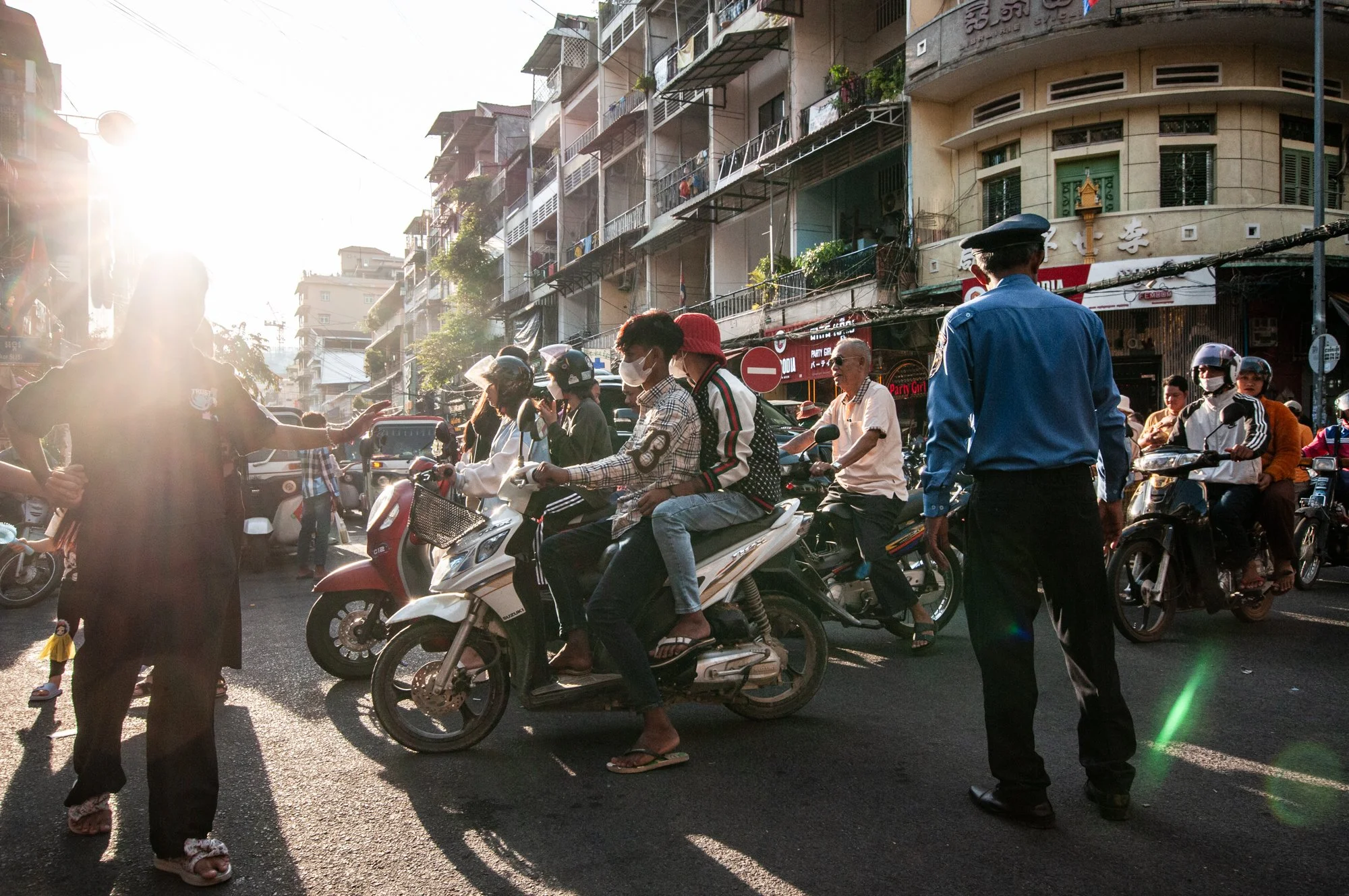  People get through a heavily congested traffic during the celebration of the Water Festival in Phnom Penh, Cambodia. 
