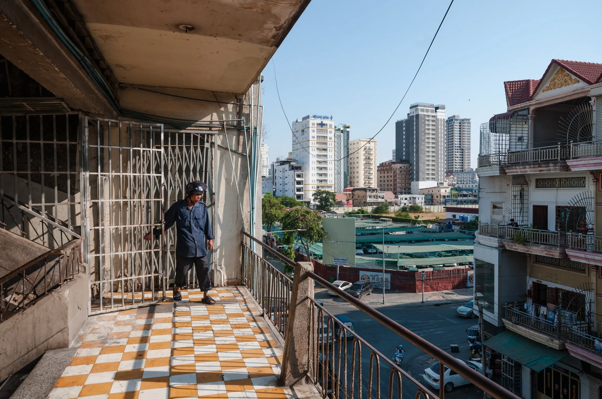  A man walks downstairs in Tampa Building located in the historic area near Central Market in Phnom Penh, Cambodia. 