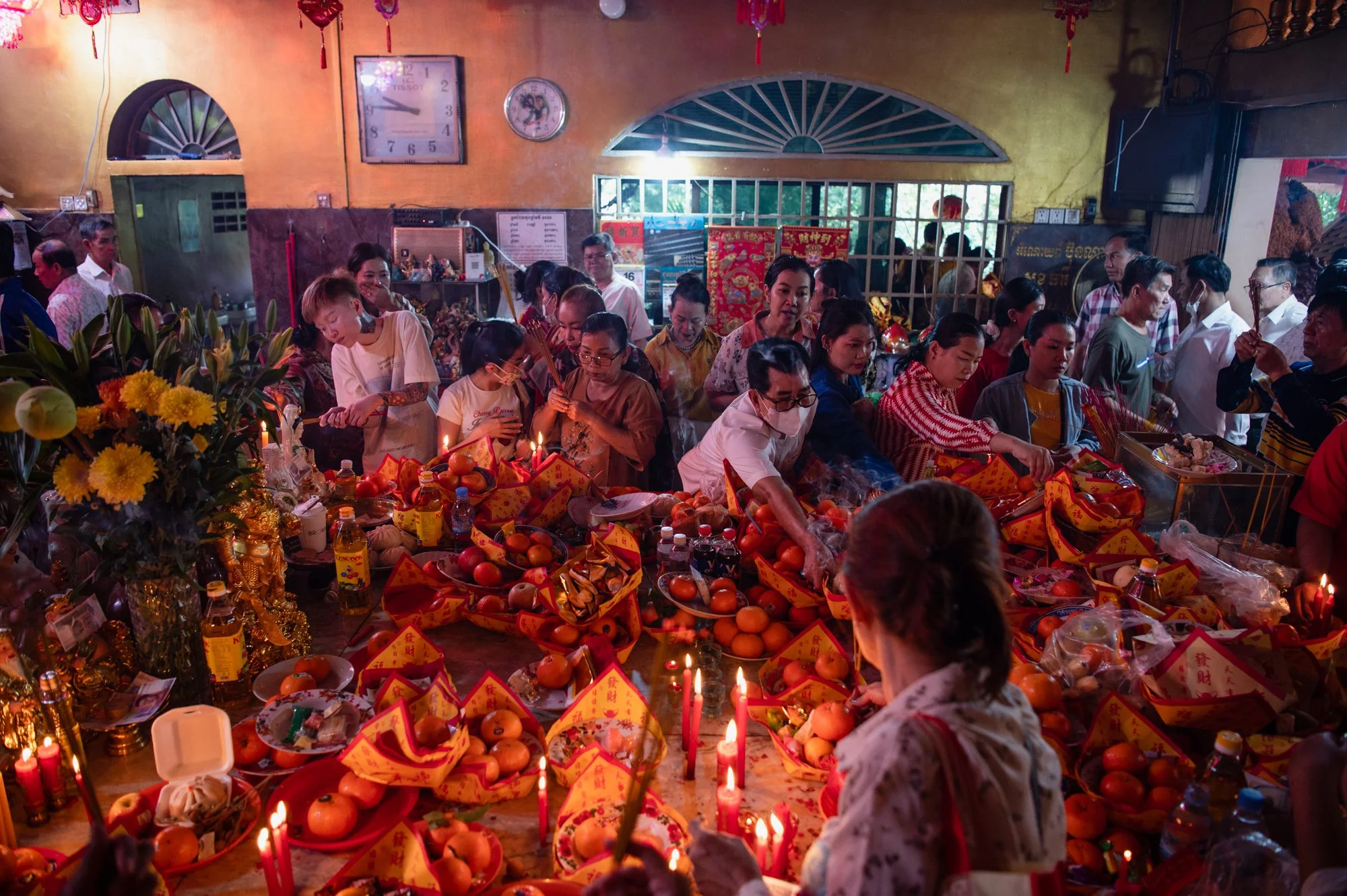  People bring gifts and food to celebrate Chinese Lunar New Year at Wat Phnom temple in Phnom Penh, Cambodia. 