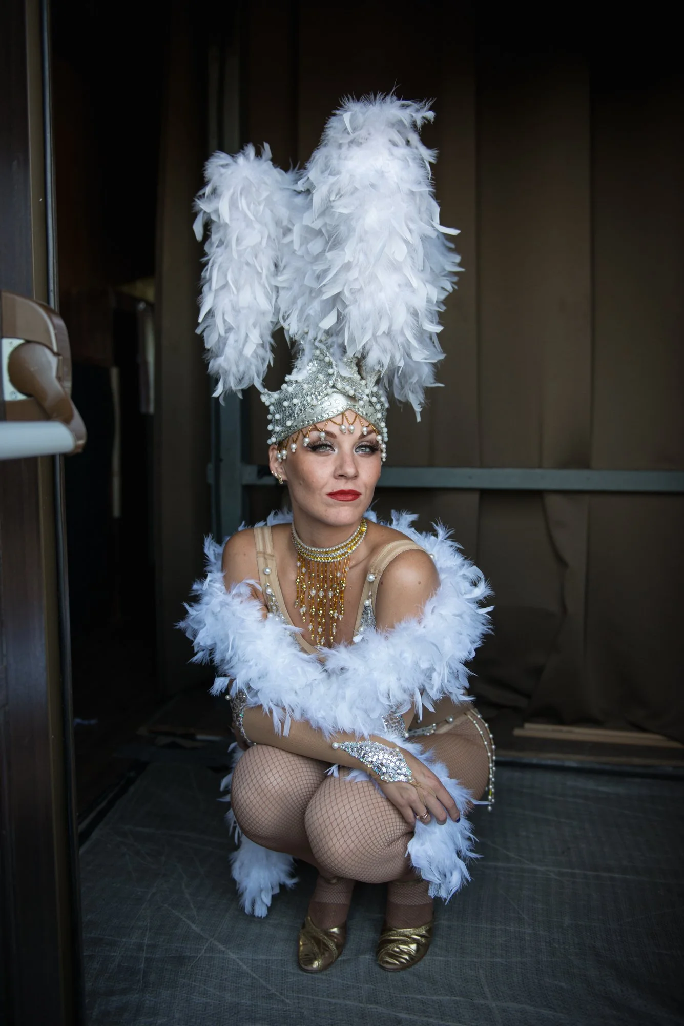 A contortionist rests during a corporate New Year's party in St. Petersburg, Russia.