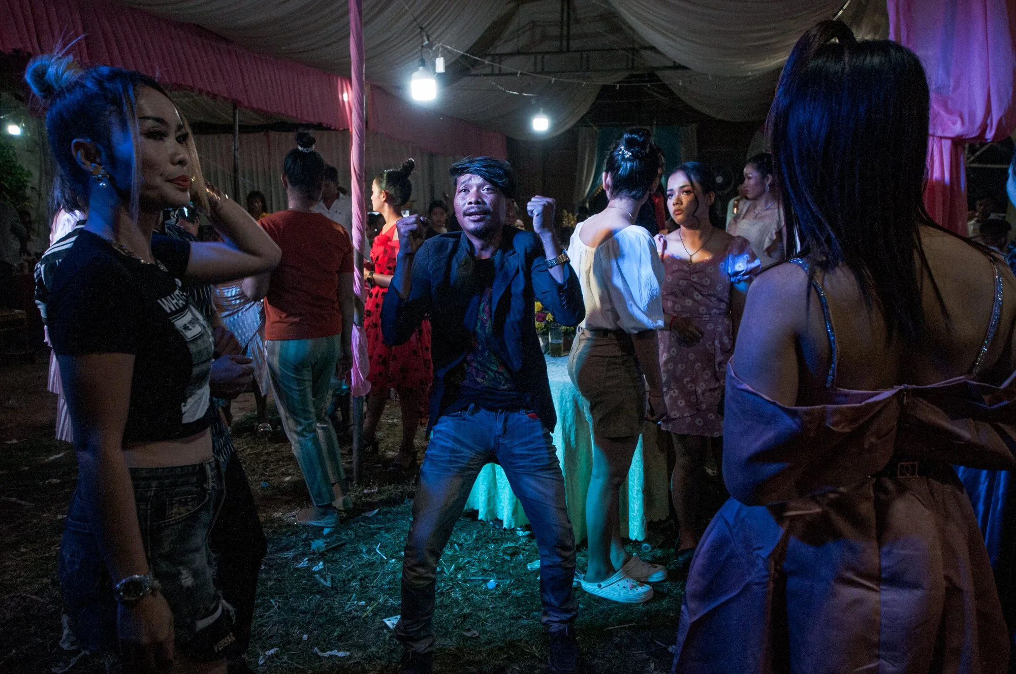 Guests dance at a traditional Khmer wedding outside of Phnom Penh, Cambodia.