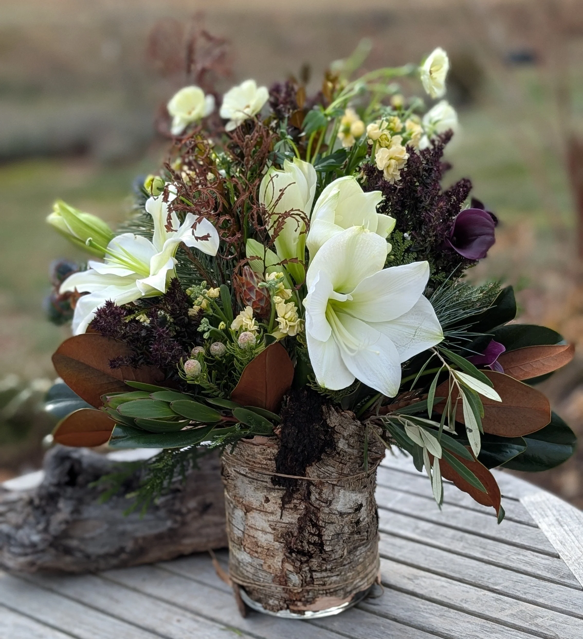 Birch bark covered vase arrangement.  Handmade, locally foraged design using fresh flowers and dried materials.