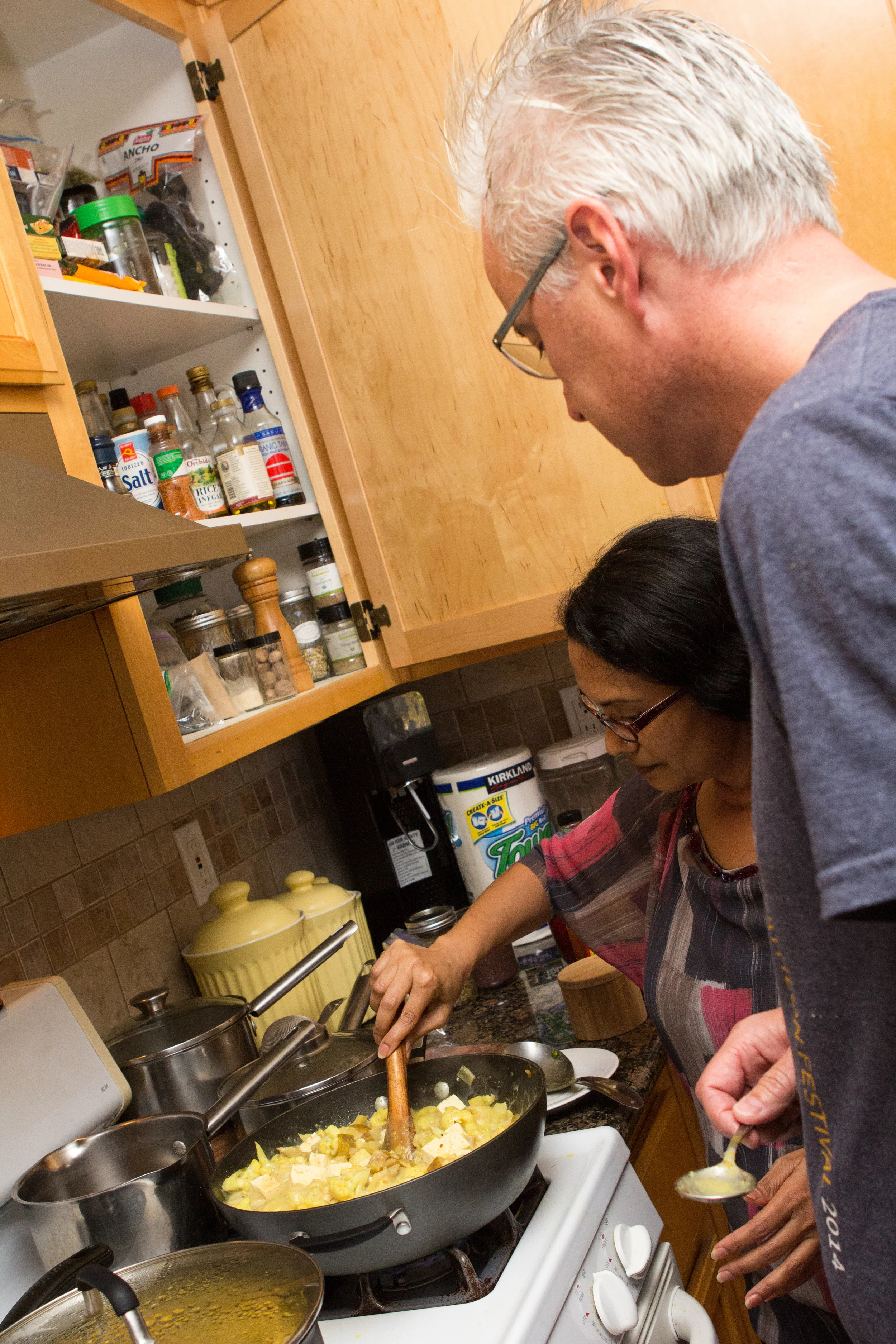 Praveena showing Tony up close and personal how to prepare and use ayurvedic spices in our "Spice of Life" retreat.