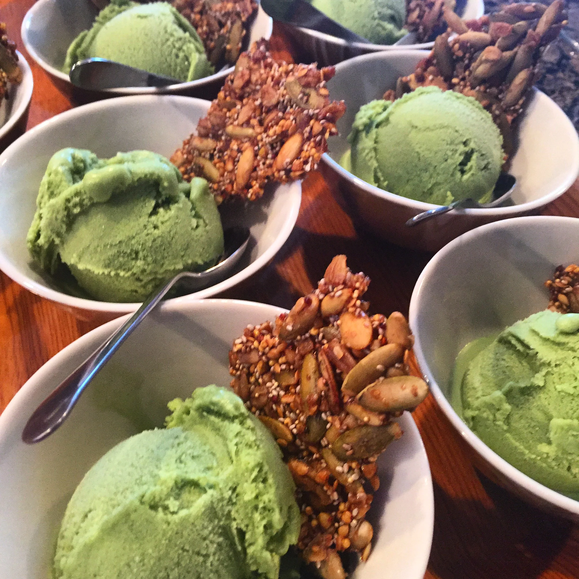 Matcha green tea coconut ice cream topped with maple quinoa brittle