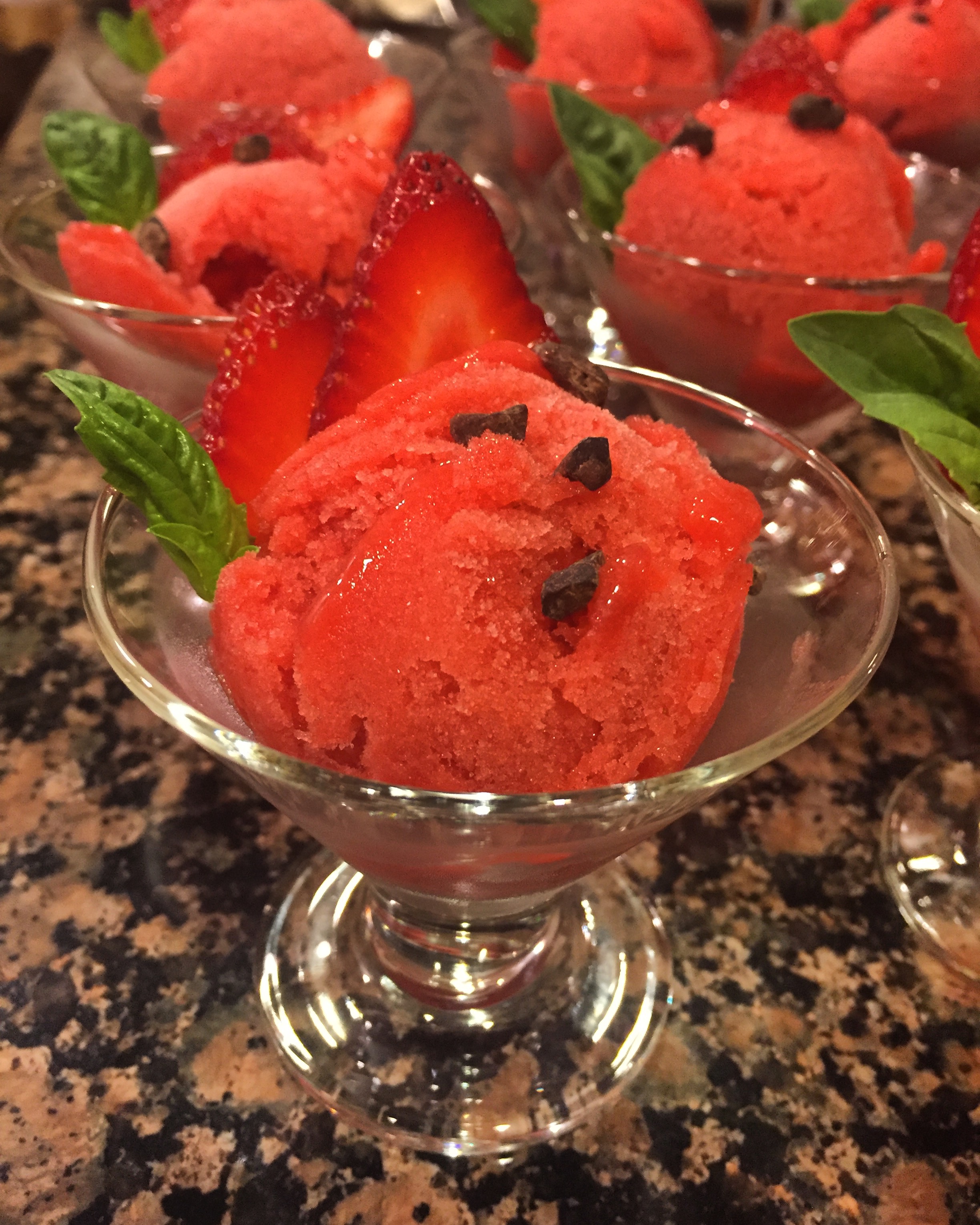Strawberry basil sorbet topped with sweet cacao nibs.