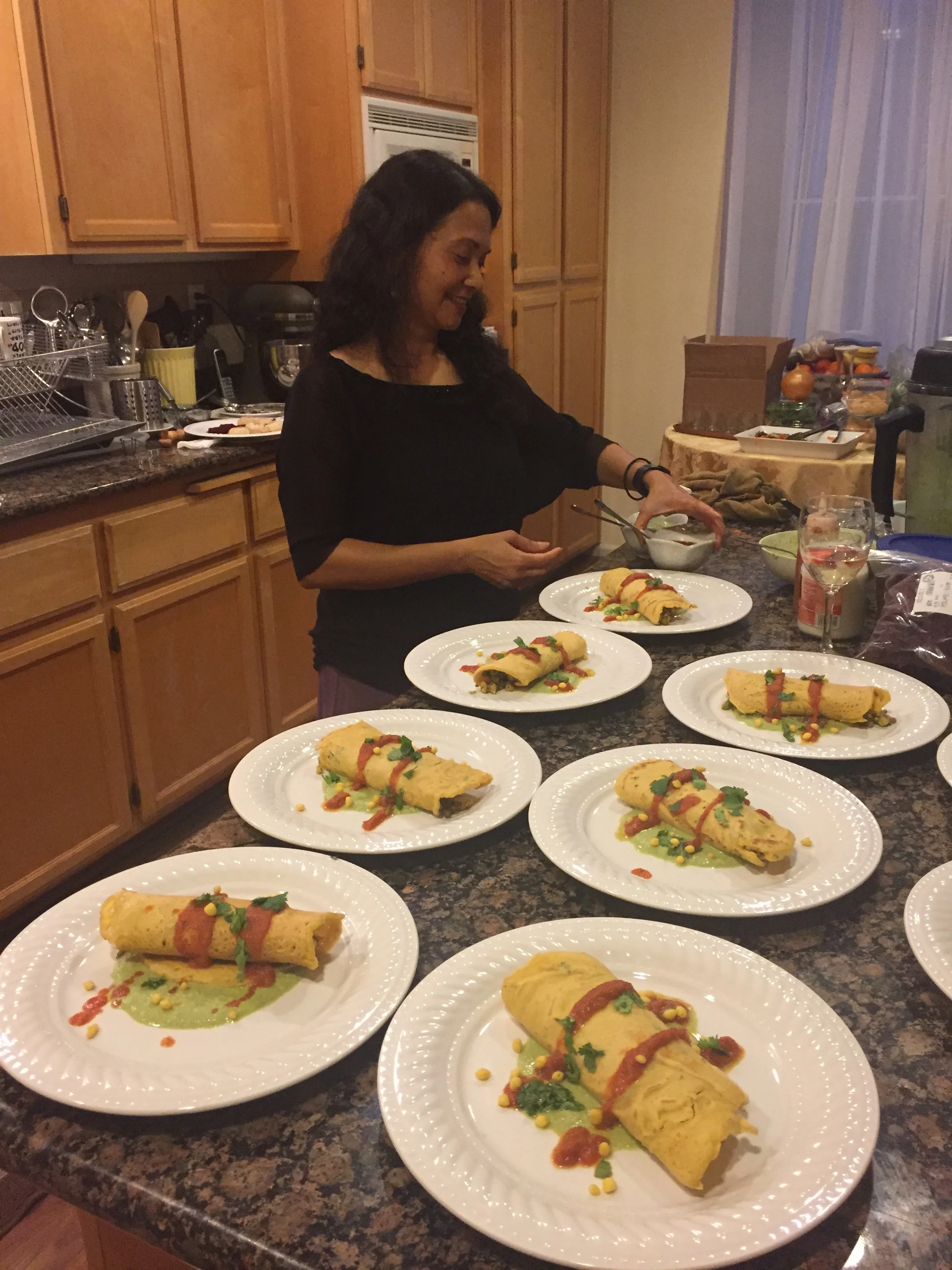Chef Kumar adding the finishing touches to the chickpea crepes.