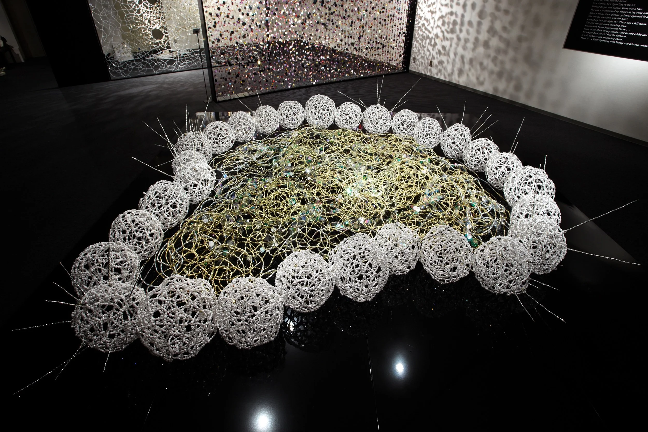   Tears of the Moon,  Installation View, Beads, brass wire and sequins, 40 x 142 × 142 inches 
