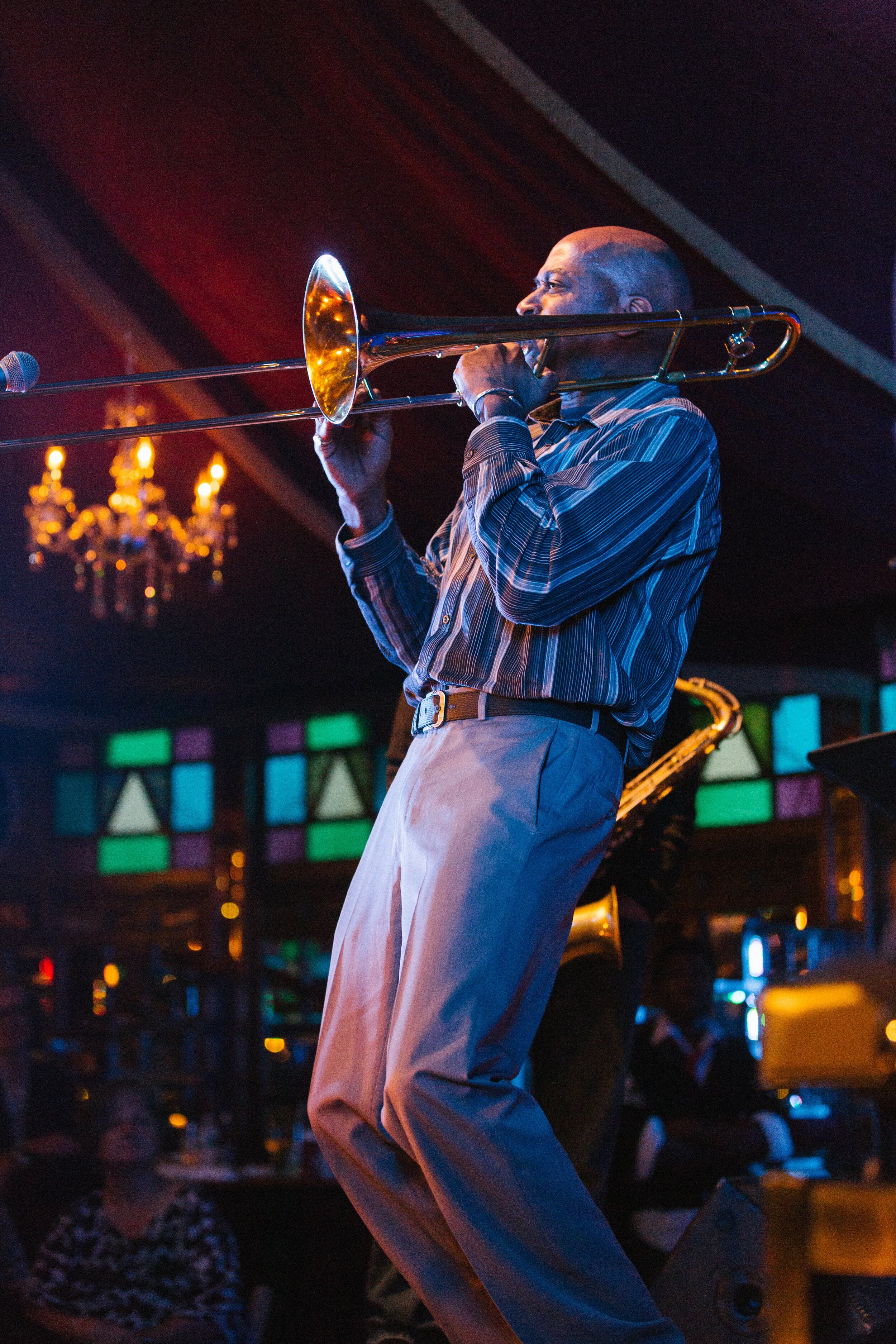 Trombonist plays a solo in the opening minutes of the Harlem on the Hudson Experience at the Bard Spiegeltent.jpg