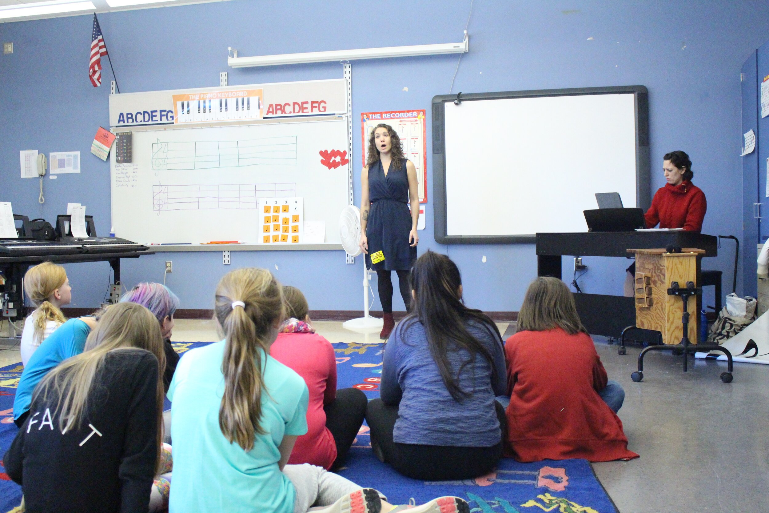 Celine Mogielnicki sings Strauss for 5th graders.jpg