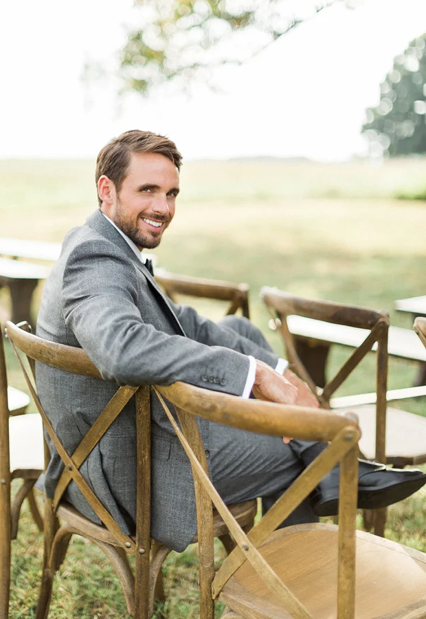 Keep it buttoned unless you sit down, then unbutton your coat.
