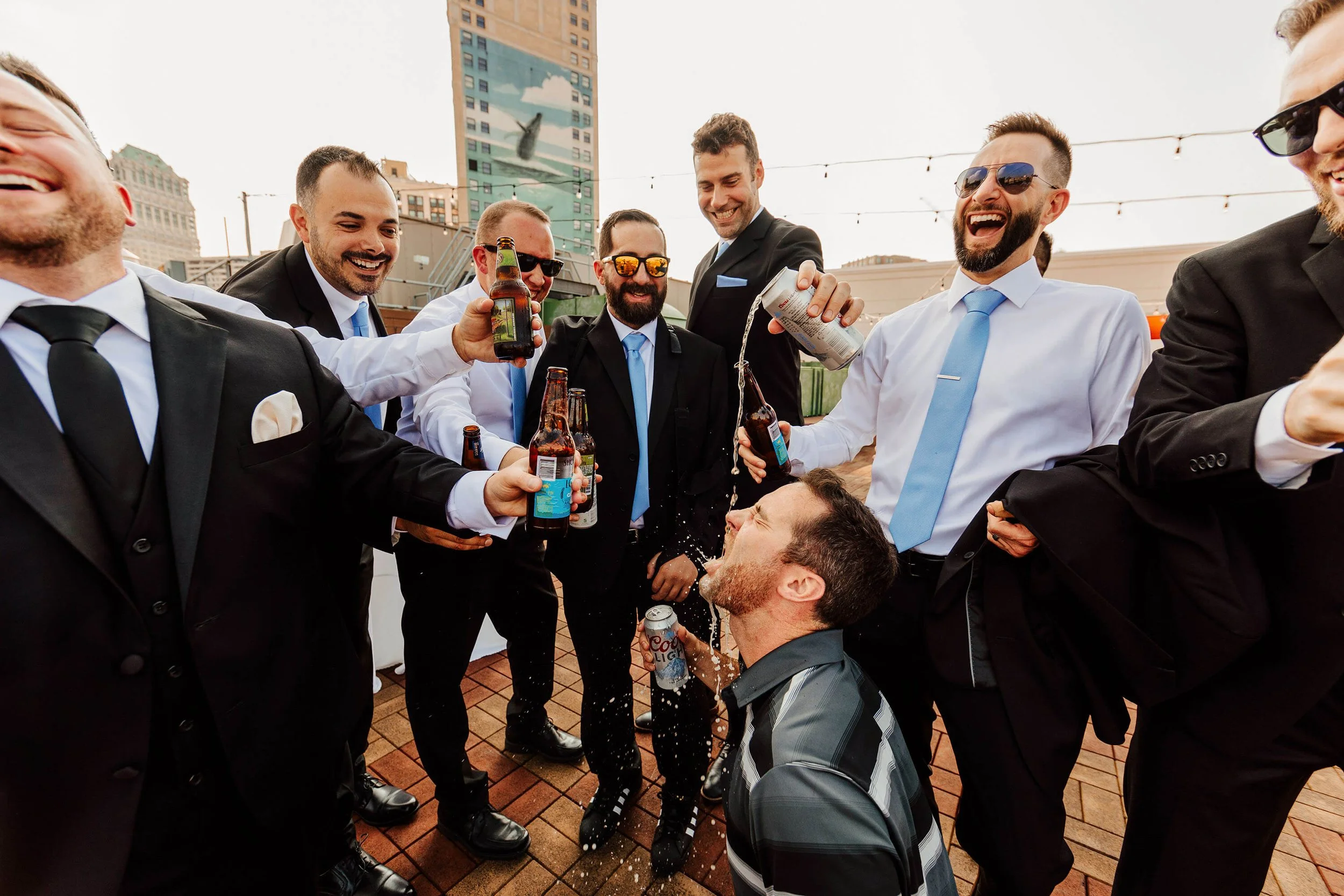 Detroit Opera House wedding photographer candid groomsmen rooftop beer celebration getting ready, top downtown Detroit Michigan wedding photography