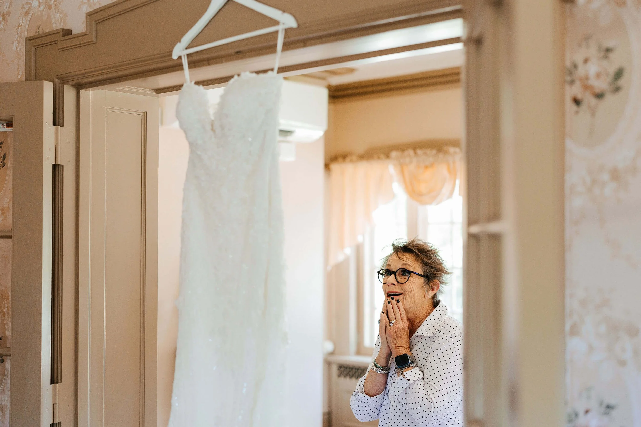 Felt Estate wedding photographer Saugatuck Michigan candid mother reaction seeing bridal gown, best West Michigan wedding photography