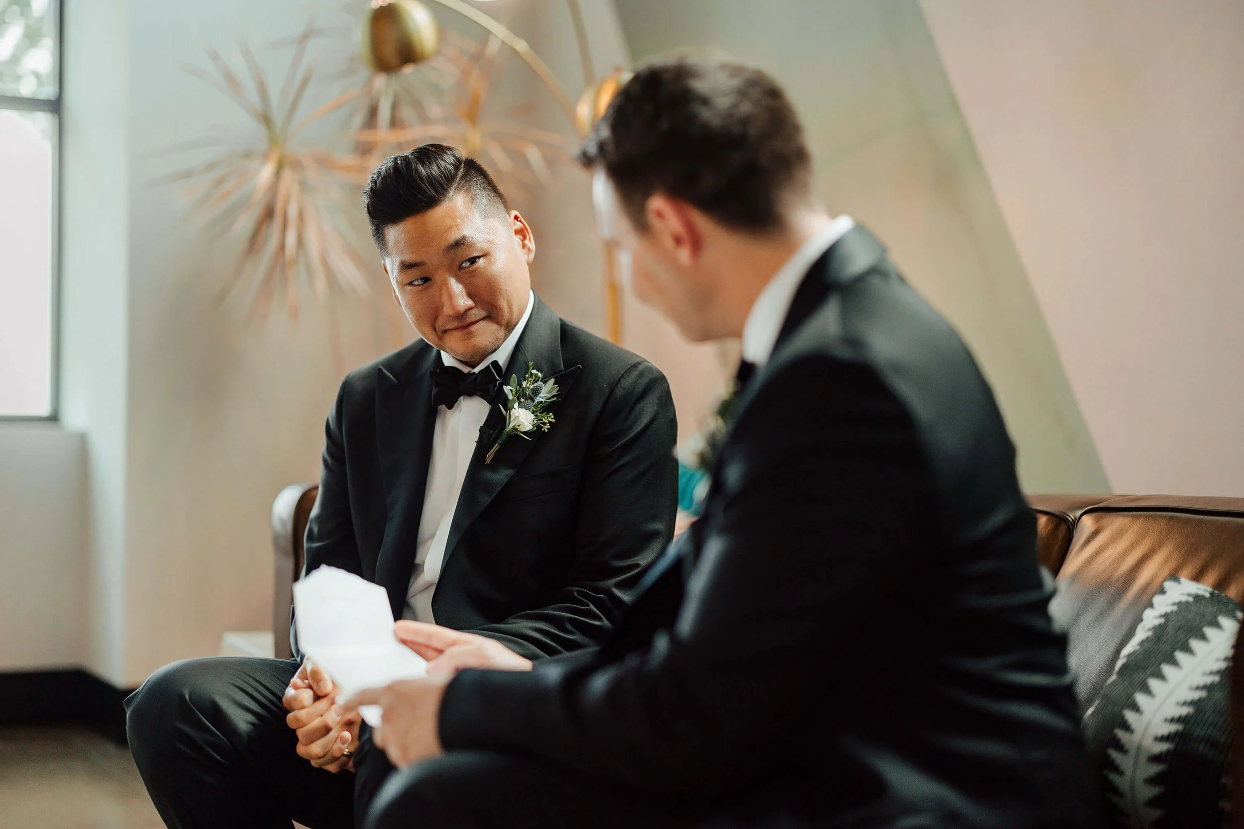GAUPERphoto West Michigan wedding photographer groom reading emotional letter during getting ready, documentary wedding photography Grand Rapids