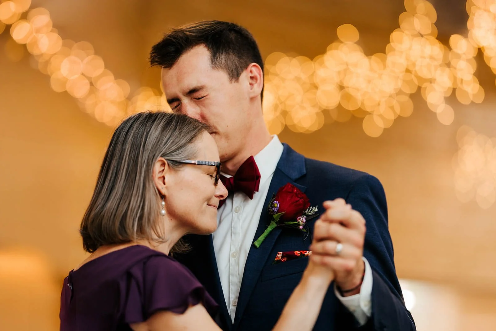 GAUPERphoto The Gathering wedding photographer Coldwater Michigan candid groom kissing mother head mother son dance, top emotional documentary wedding photography