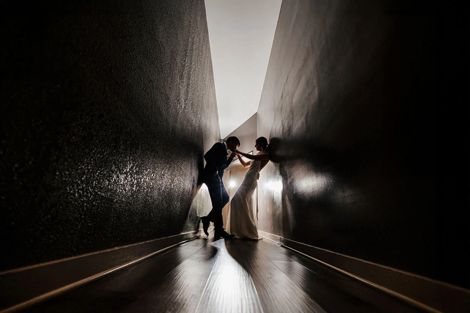 South Haven Creations wedding photographer South Haven Michigan luxury editorial bride and groom dramatic dark narrow corridor portrait, best West Michigan wedding photography