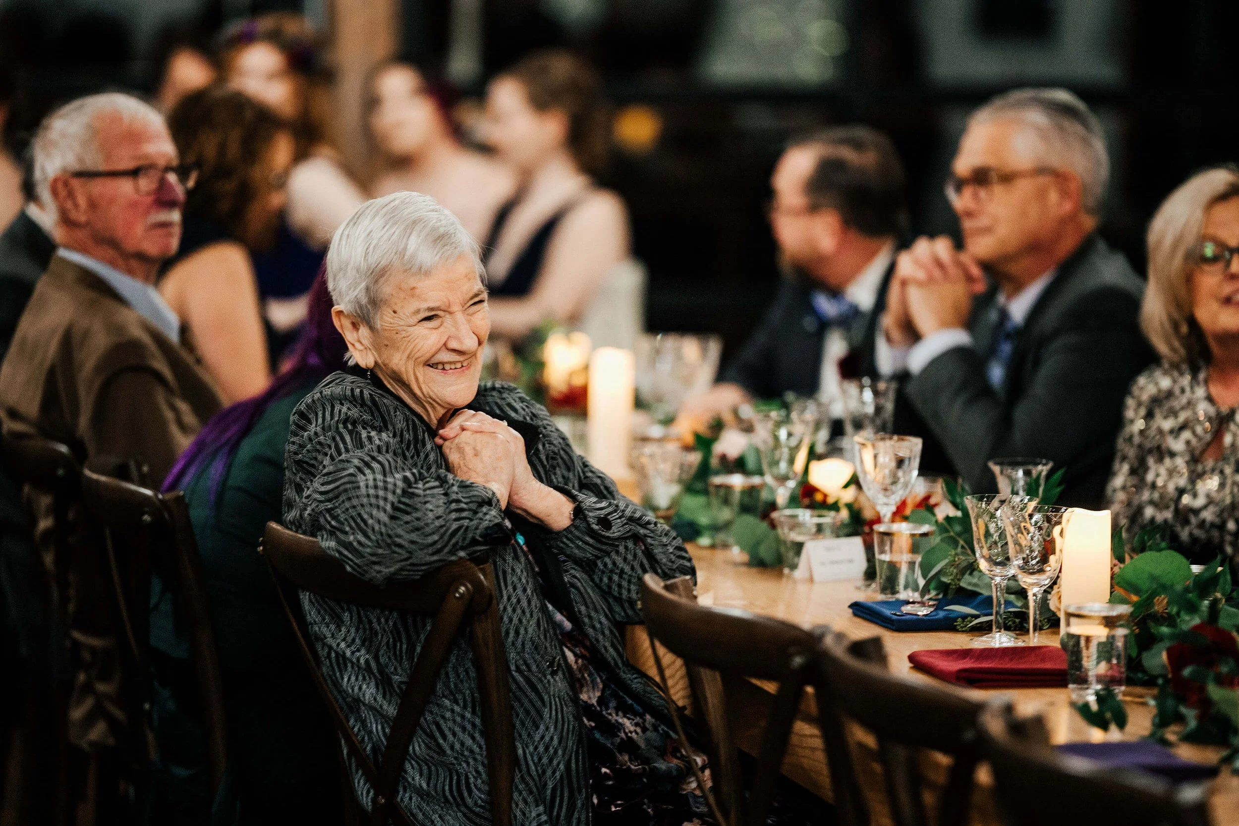Westers Family Vineyard wedding photographer Jackson Michigan candid grandmother smiling at reception, best Michigan winery wedding photography