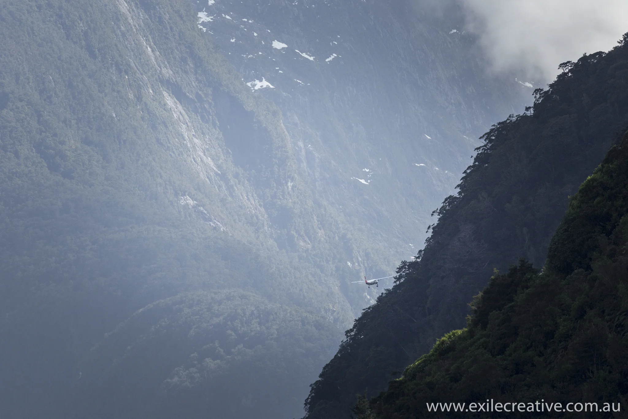 There's and airfield right at Milford Sound that allows you to take a flight through the hills. Canon 5Dmiii, 100-400L ii IS @ 400mm, ISO800, f/6.3, 1/2500s