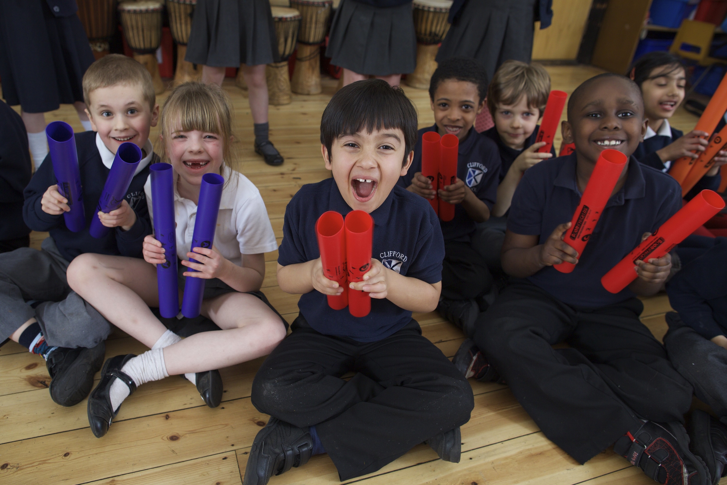 Kids having fun at Unbeatable Energy drumming workshops.