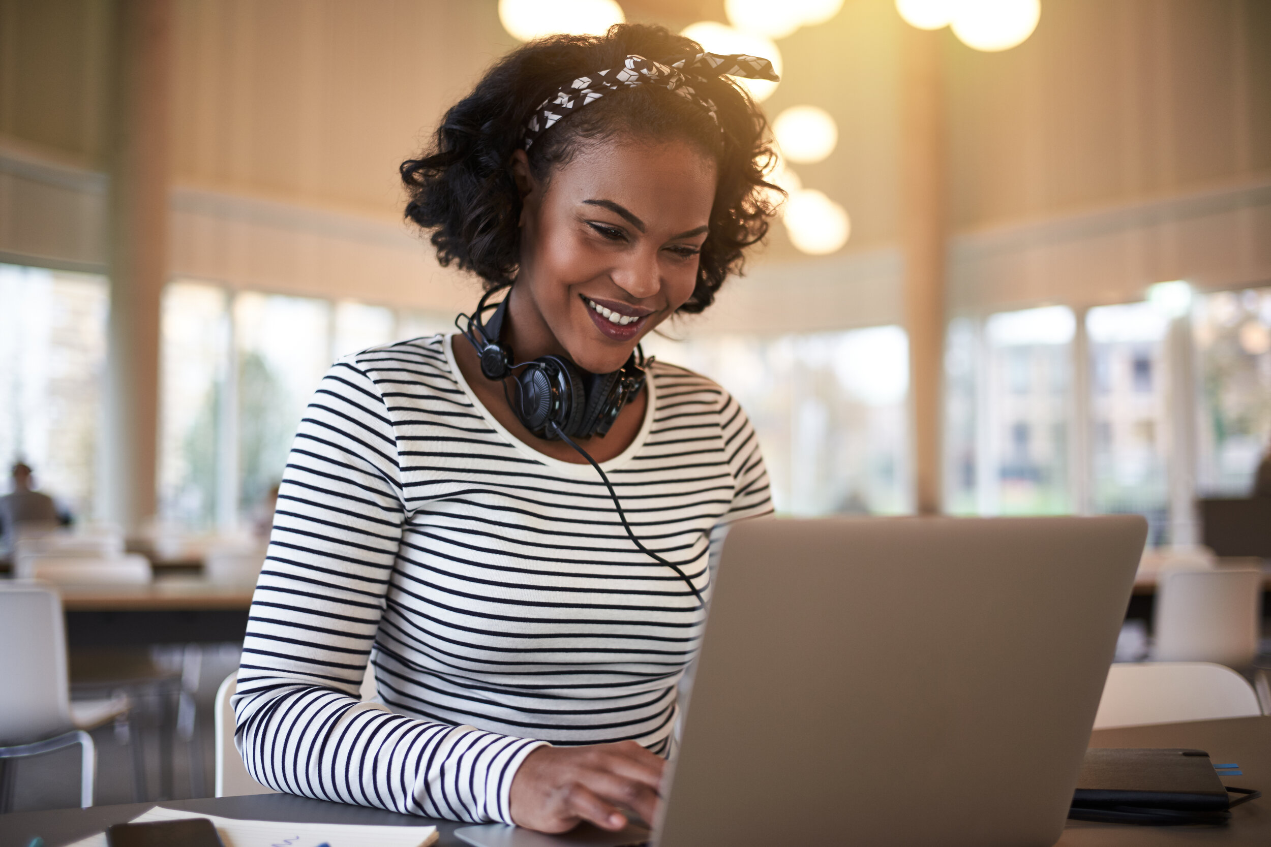 young-african-university-student-using-a-laptop-on-AYDFRVL.jpg