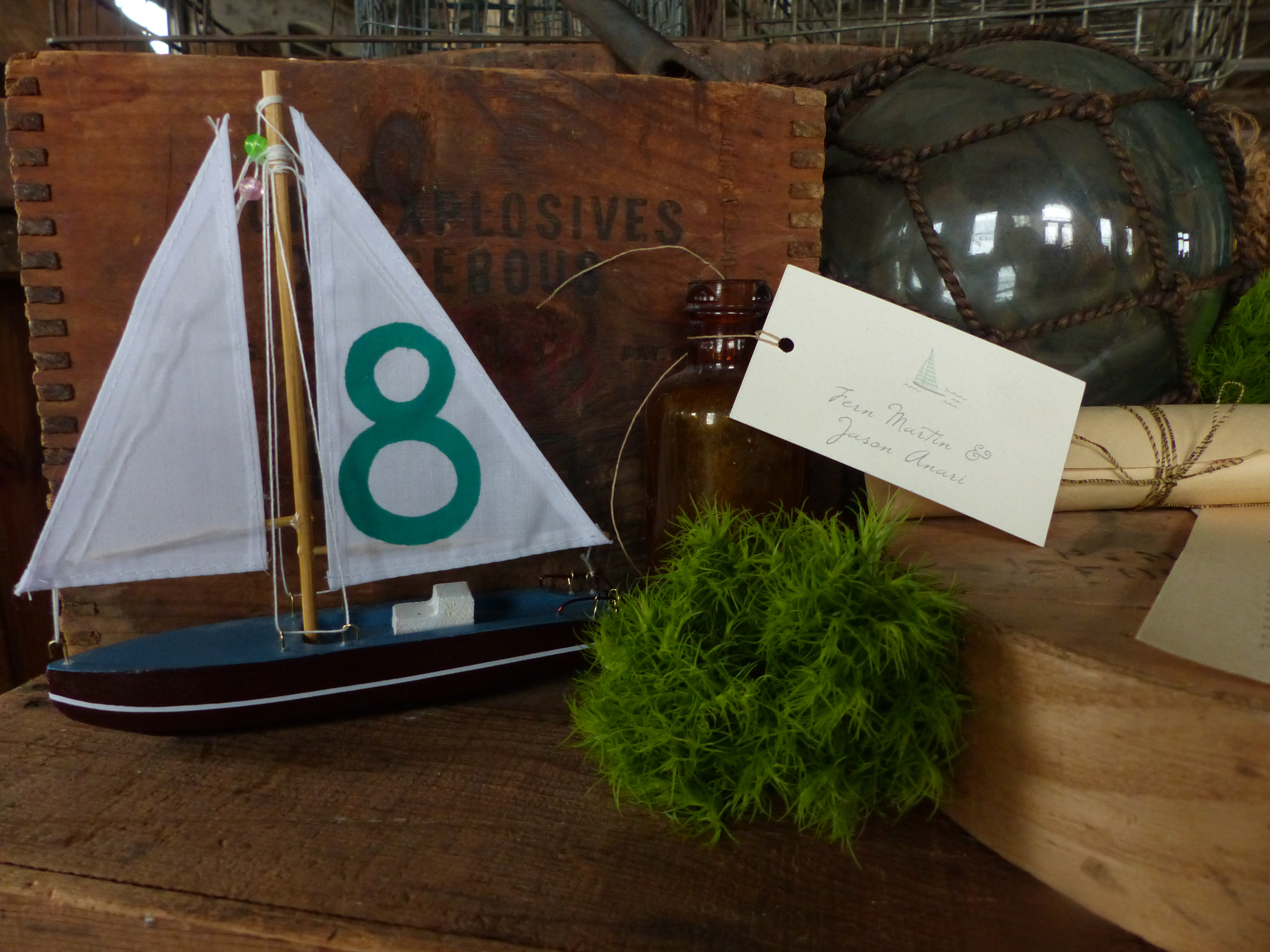  For table numbers we painted the sails of model boats.&nbsp; 