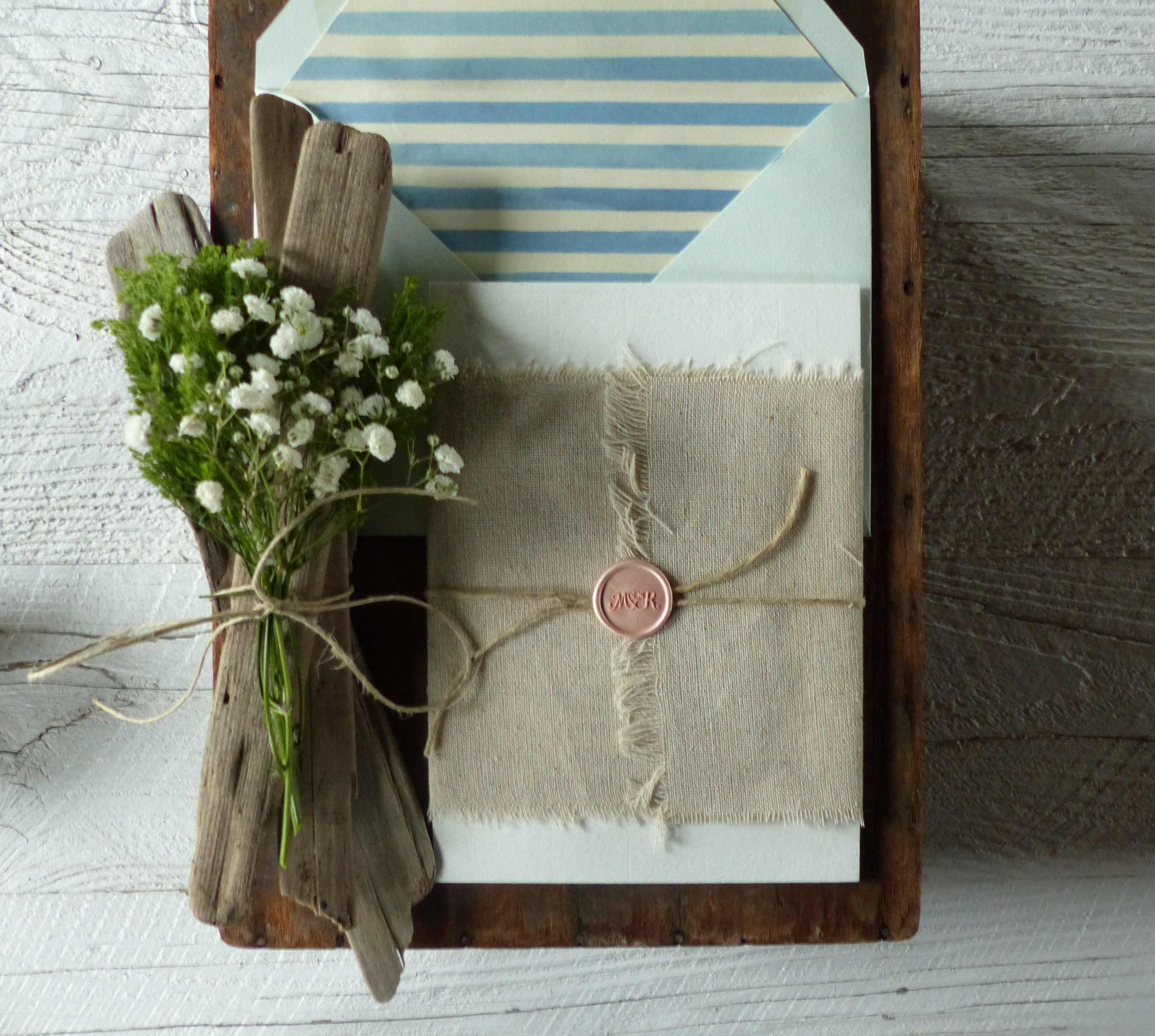  The invitation was wrapped with Belgian linen and sealed with a custom wax seal embossed with the couple's monogram.&nbsp; 