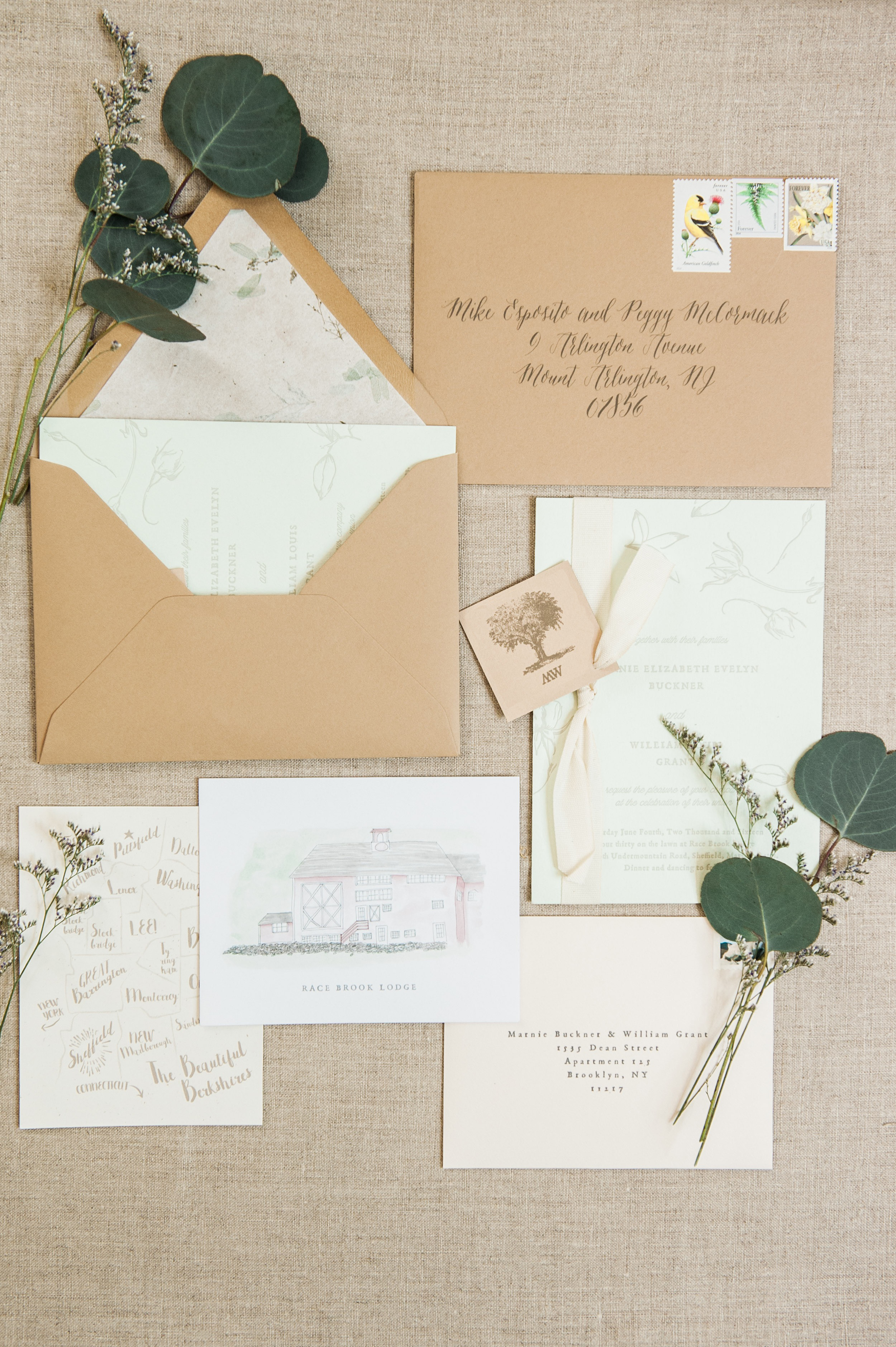  The main card, letterpress printed in pale gray on a duplexed pale green card, was inspired by spring with whimsical buds and leaves floating around a simple but vintage type treatment. We chose a handmade paper envelope liner with real leaf inclusi