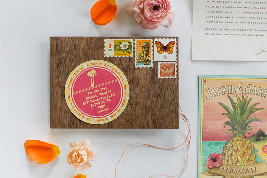  A vibrant collection of collateral pieces were created for the week and day of the wedding. From place cards and signage festooned with hand-painted lush tropical flora, to the dinner menu and itinerary which reused the toile pattern we created for 