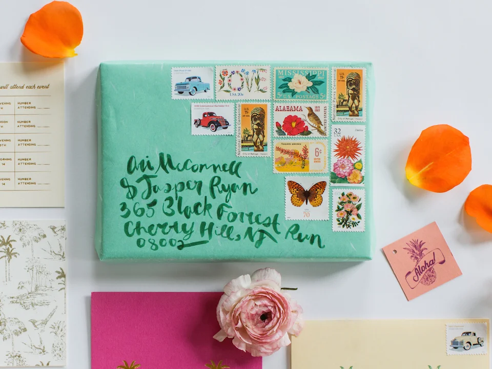 For the save the date, a custom wood mailer was backed with grass paper. Inside, a save the date card with poster style illustration was tied to a telegram style note from Jackie and Harry to their guests.