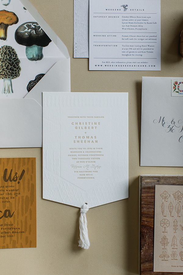 The main card was embossed with a macrame pattern and die cut in the shape of a wall hanging. We created a custom cotton yarn tassel to dangle from the bottom. 