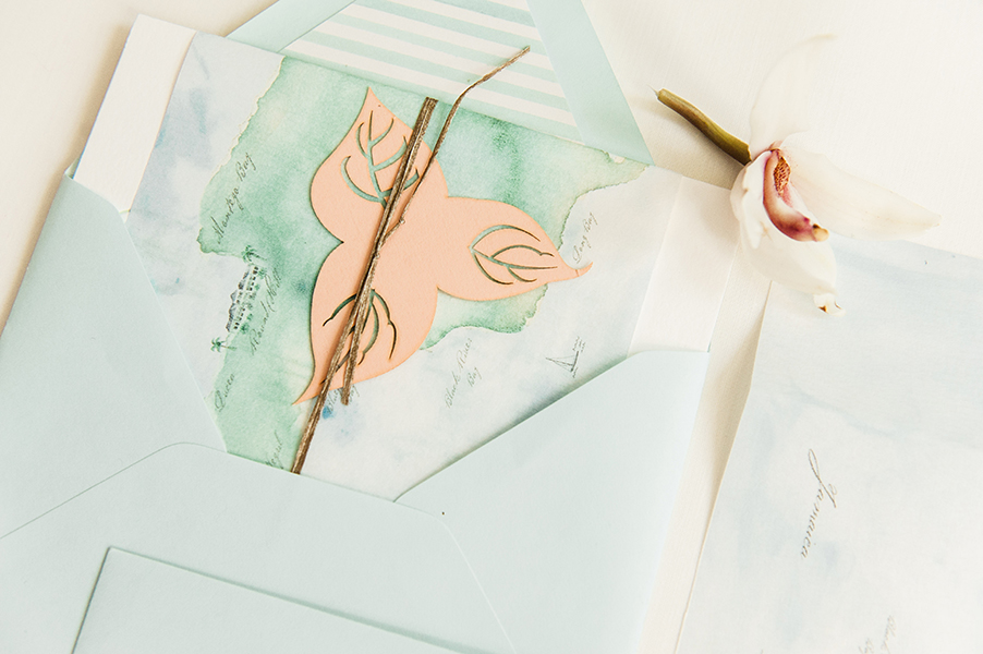 One of the main connective threads through the save the date and invitations was the bougainvillea graphic. Used here in on a mini laser cut card carrying the website URL. 