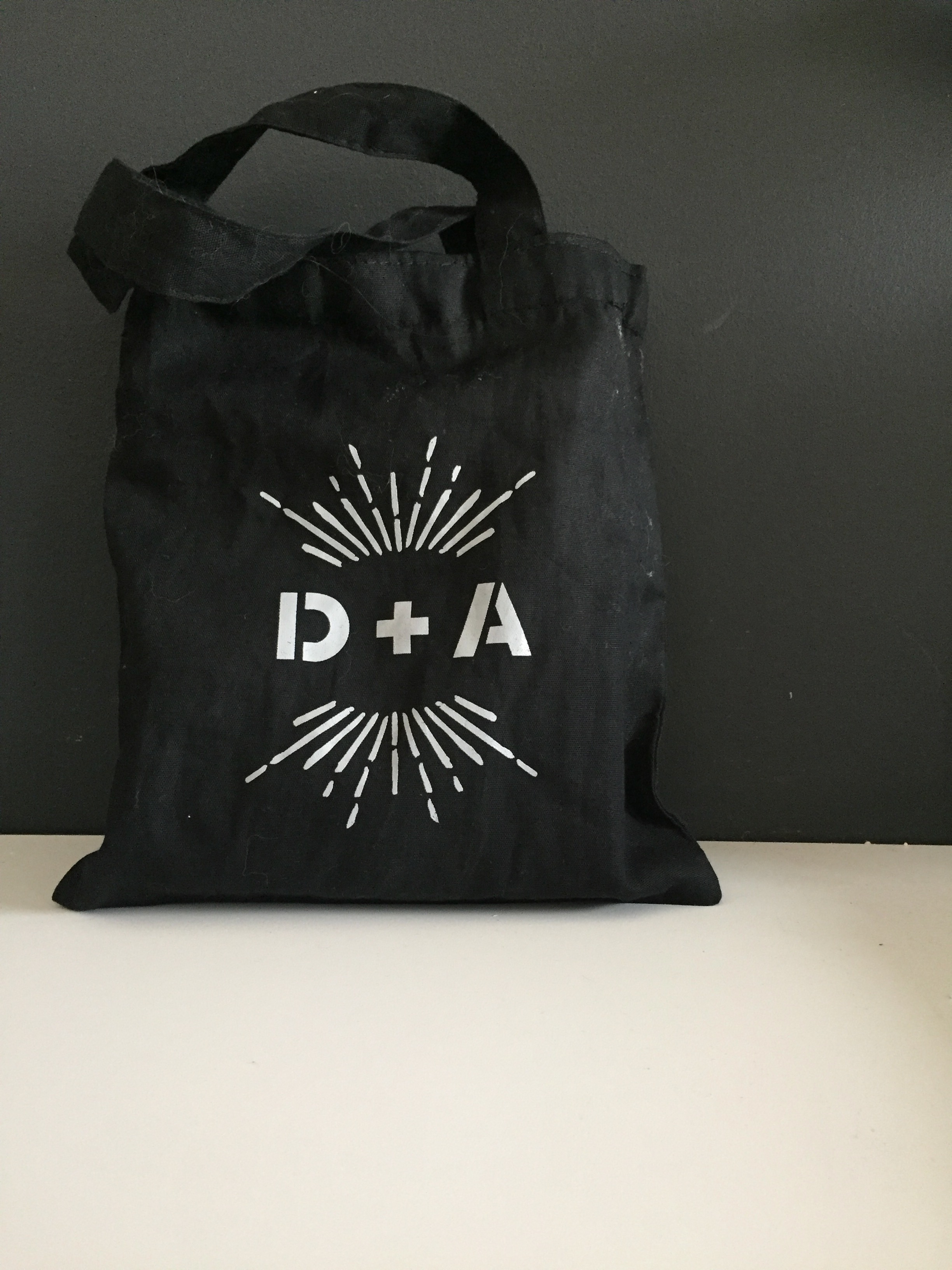 The logo carried all the way through all the day of pieces including these cotton tote bags for guests' hotel rooms!