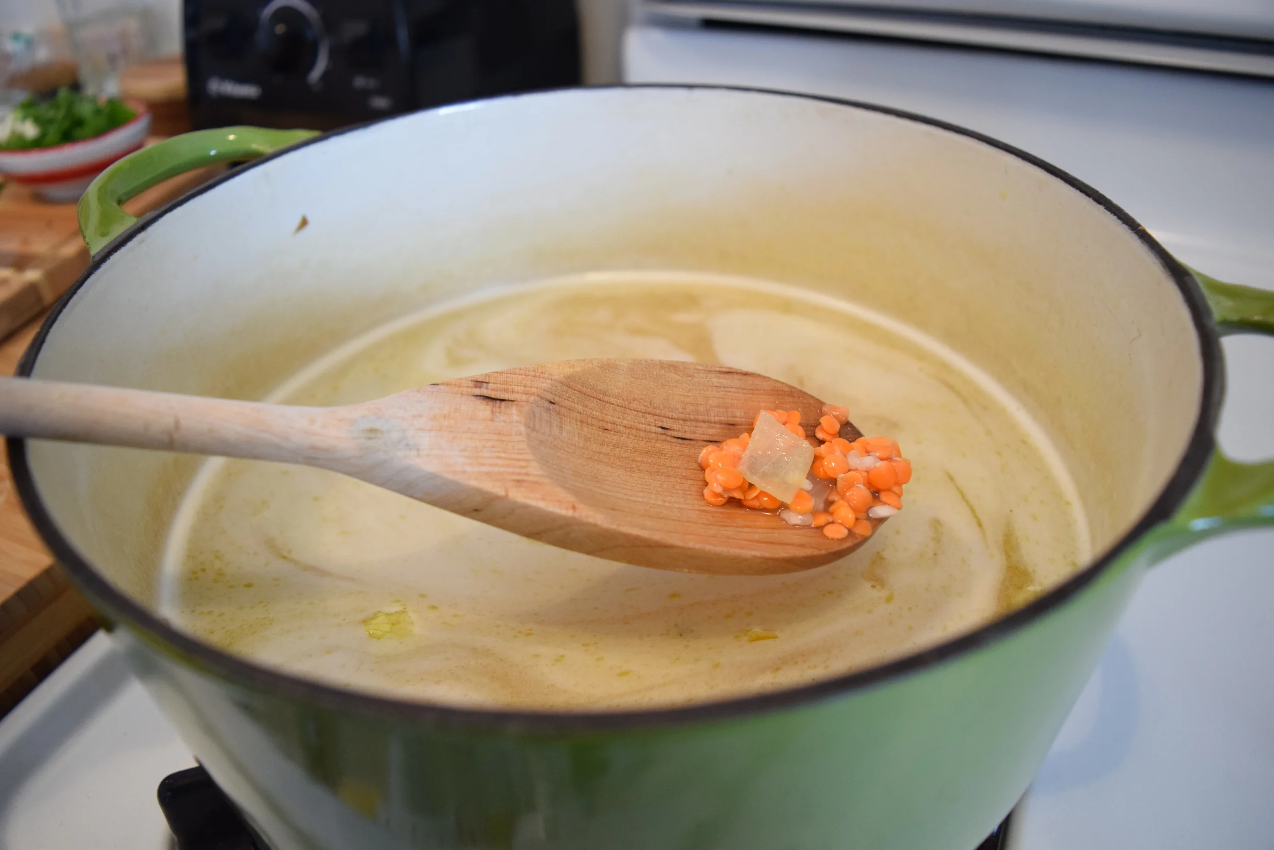 Add lentils, rice, and water to onions and let simmer. 