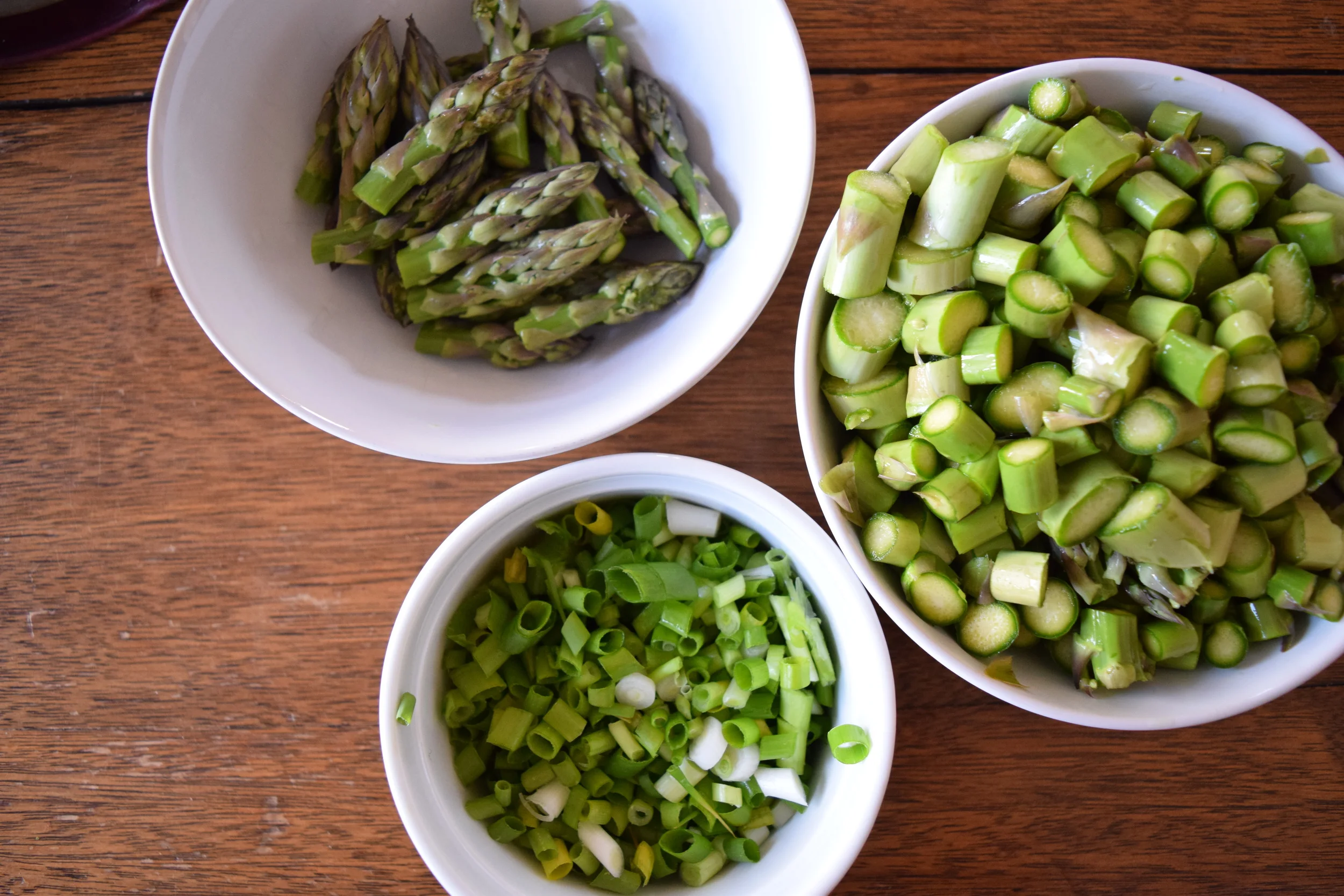 Trim and cut the stalks, leaving tips in separate bowl. 