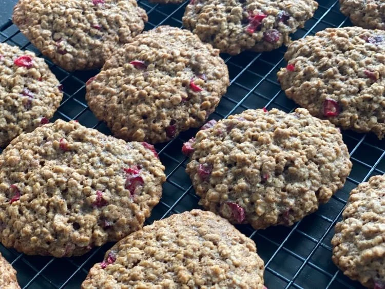 close-up picture of cranberry oatmeal cookies on a cooling rack