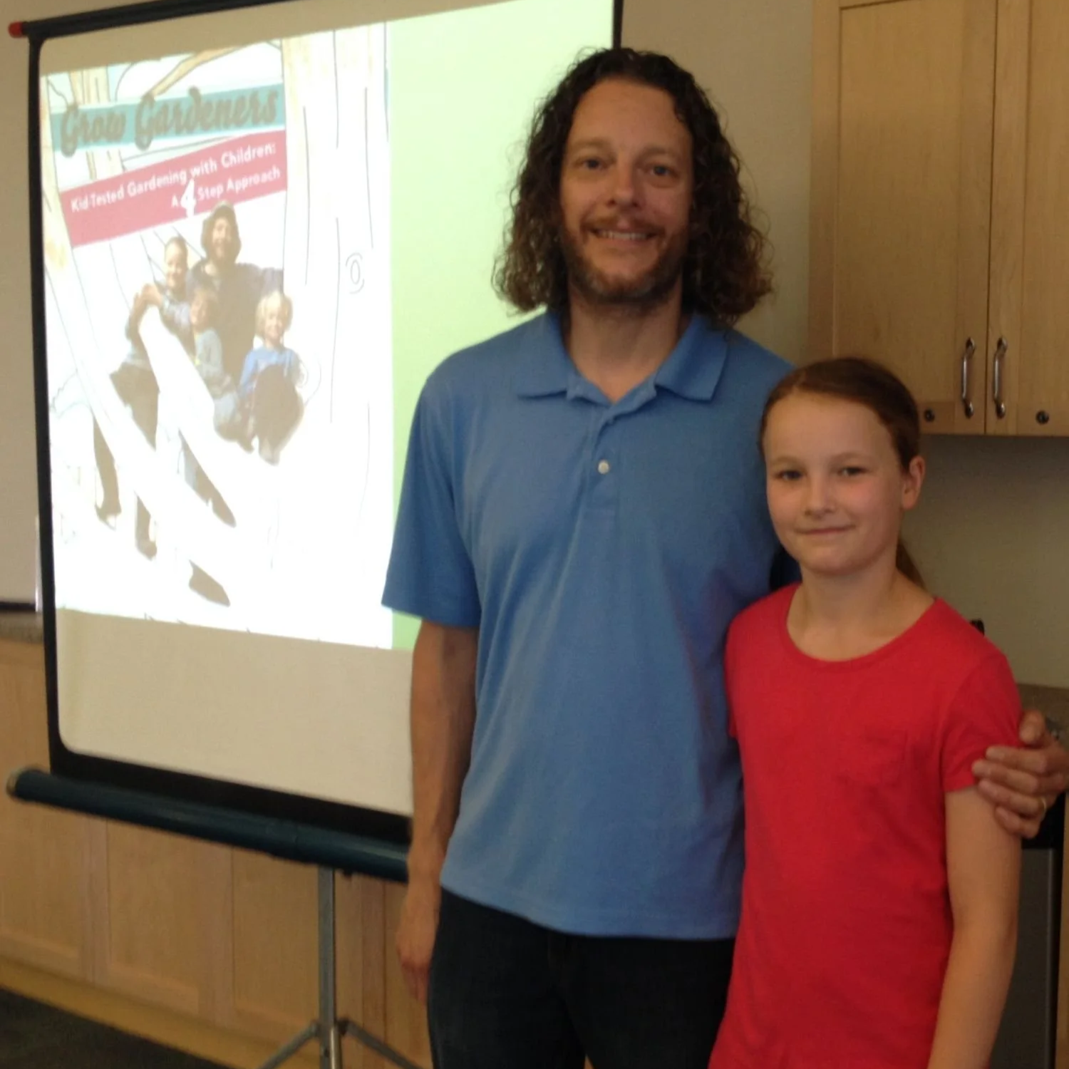 Steven and Emma Biggs giving a library presentation after Grow Gardeners was published