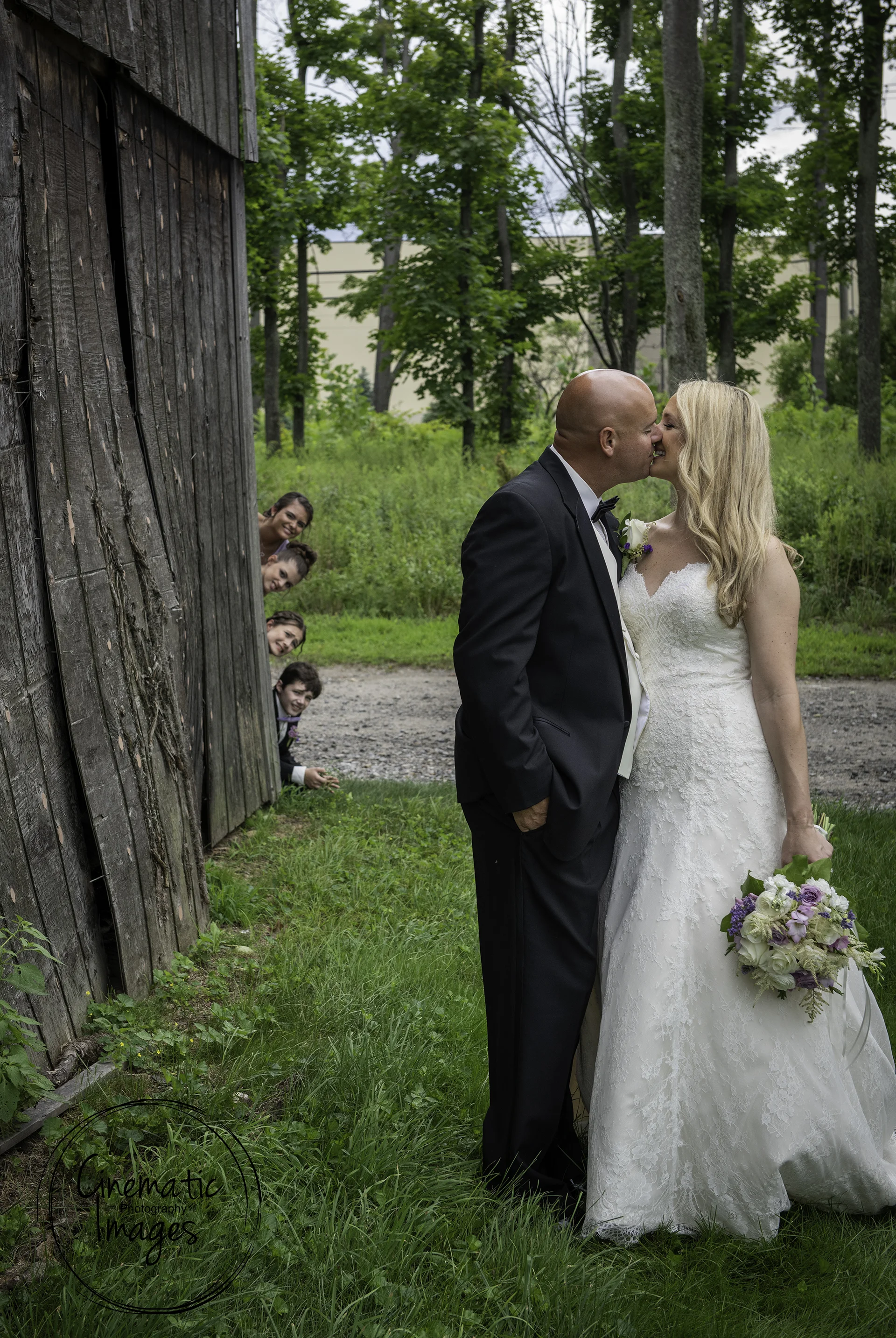 Couples children peeking around the barn at Maneeley’s Banquets in South Windsor.