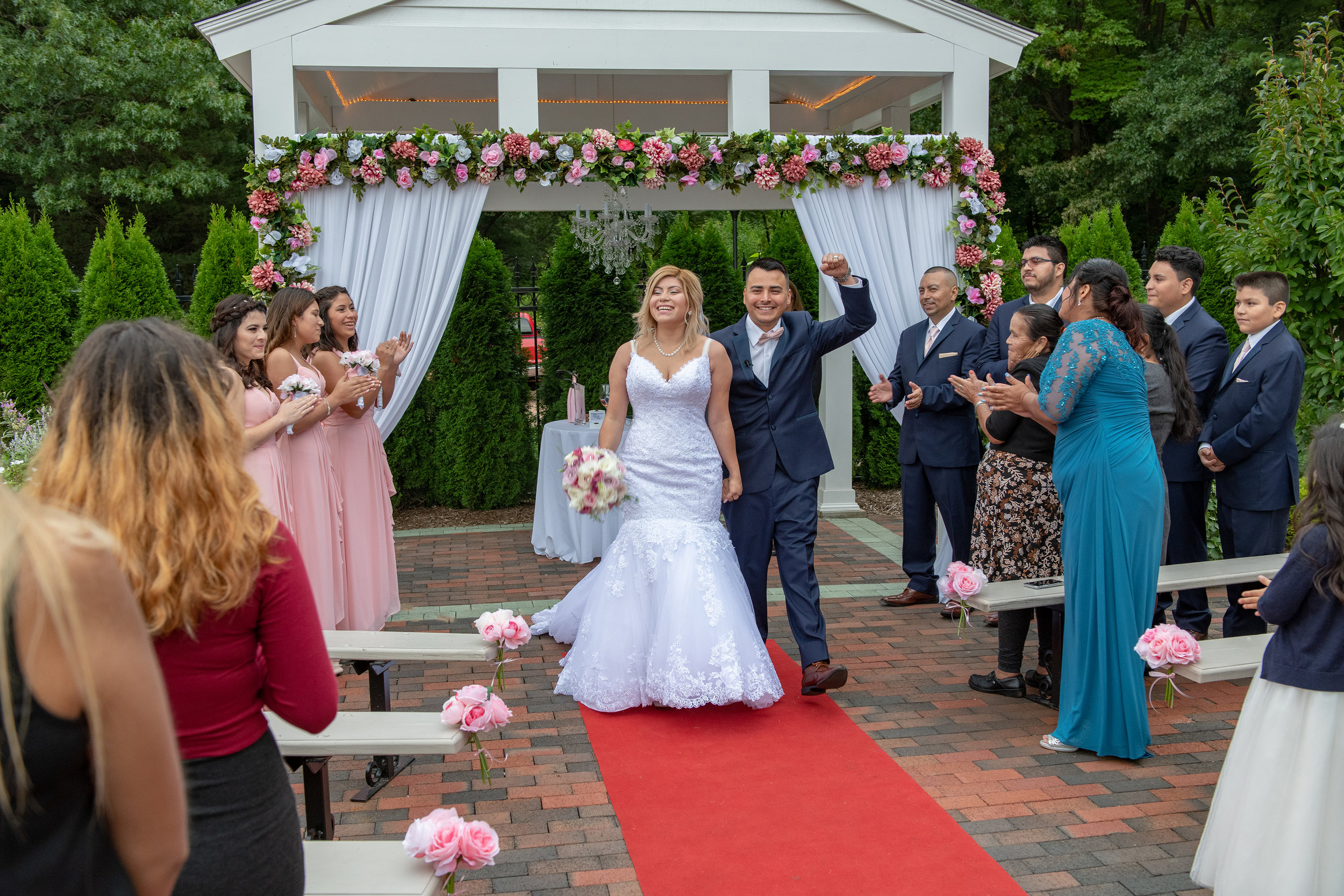 THE WEDDING CEREMONY AT WICKHAM PARK IS OVER THE BRIDE AND GROOM EXIT THE CEREMONY.jpg