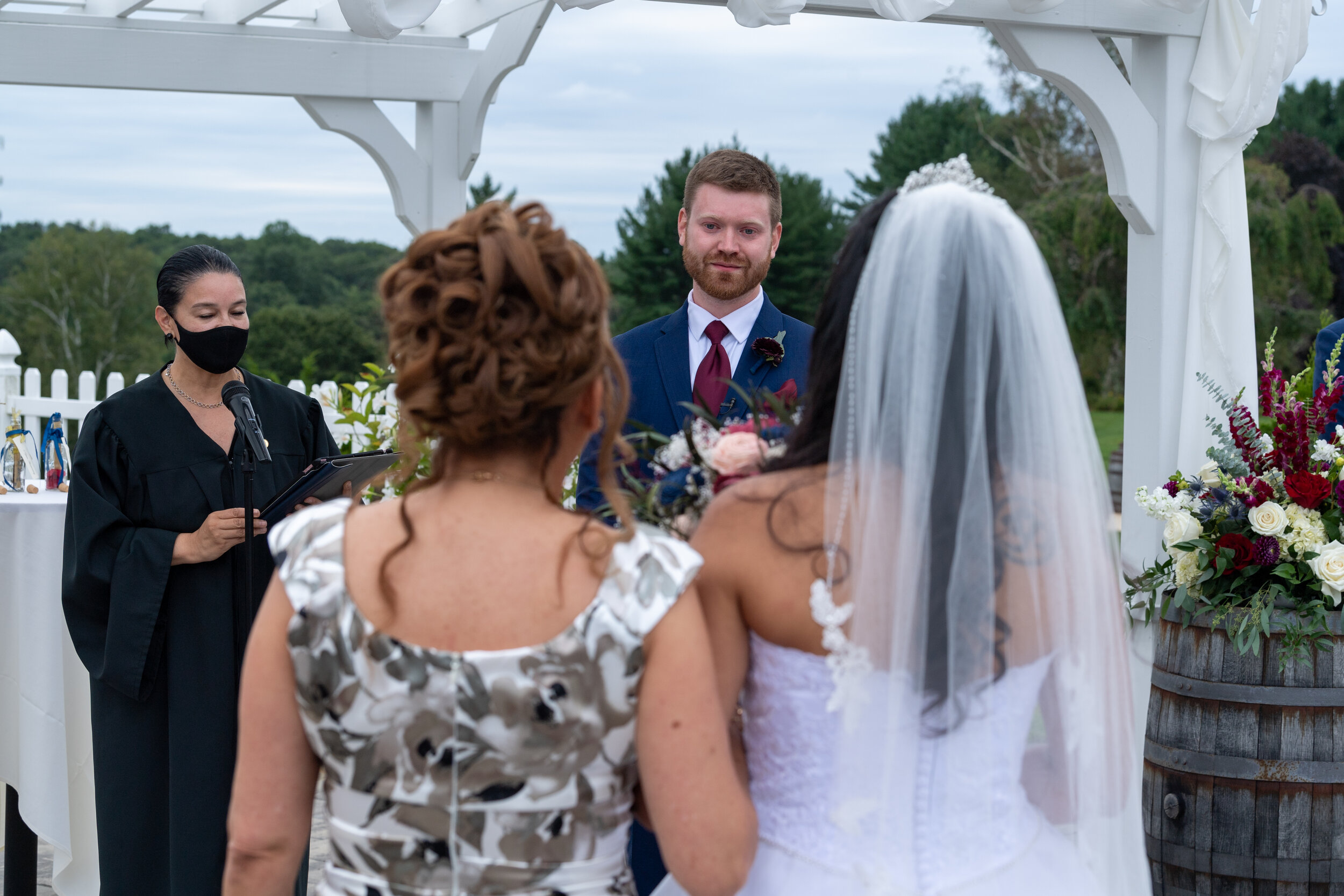 groom and bride at ceremony at Birchwoods at Oak lane.jpg