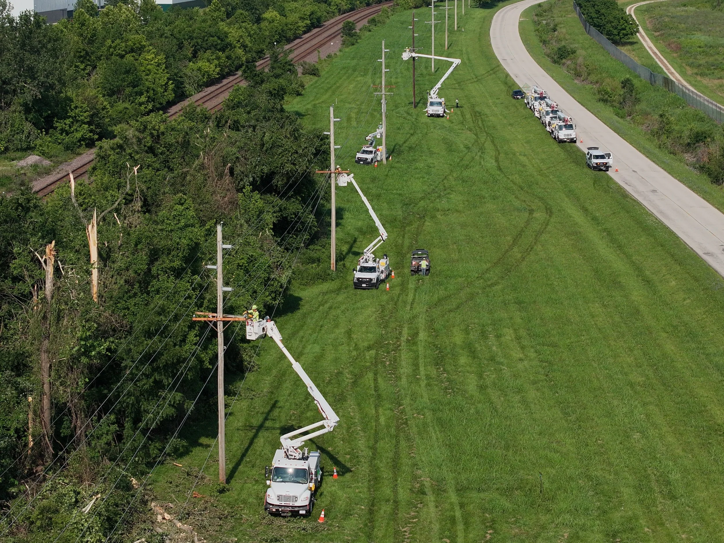 Crews work to repair damaged power line infrastructure in Jefferson City following the July 4 storms.