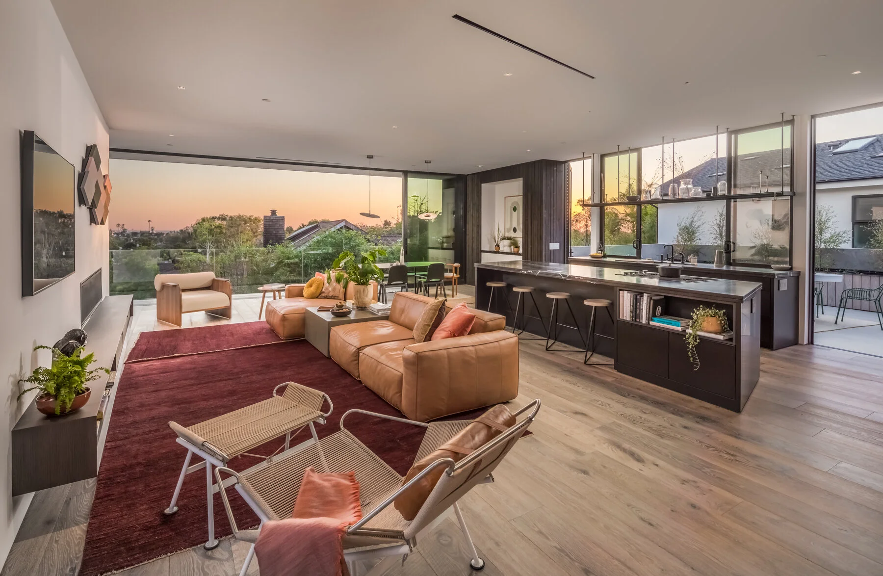  Along with an open-plan layout and all-weather outdoor gathering space, the home also includes an extra long kitchen-island bar tailor-made for festivities. 