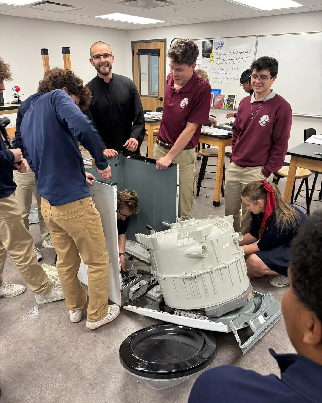 Br Simon had a blast taking apart an old dishwasher with his physics class at JPG!