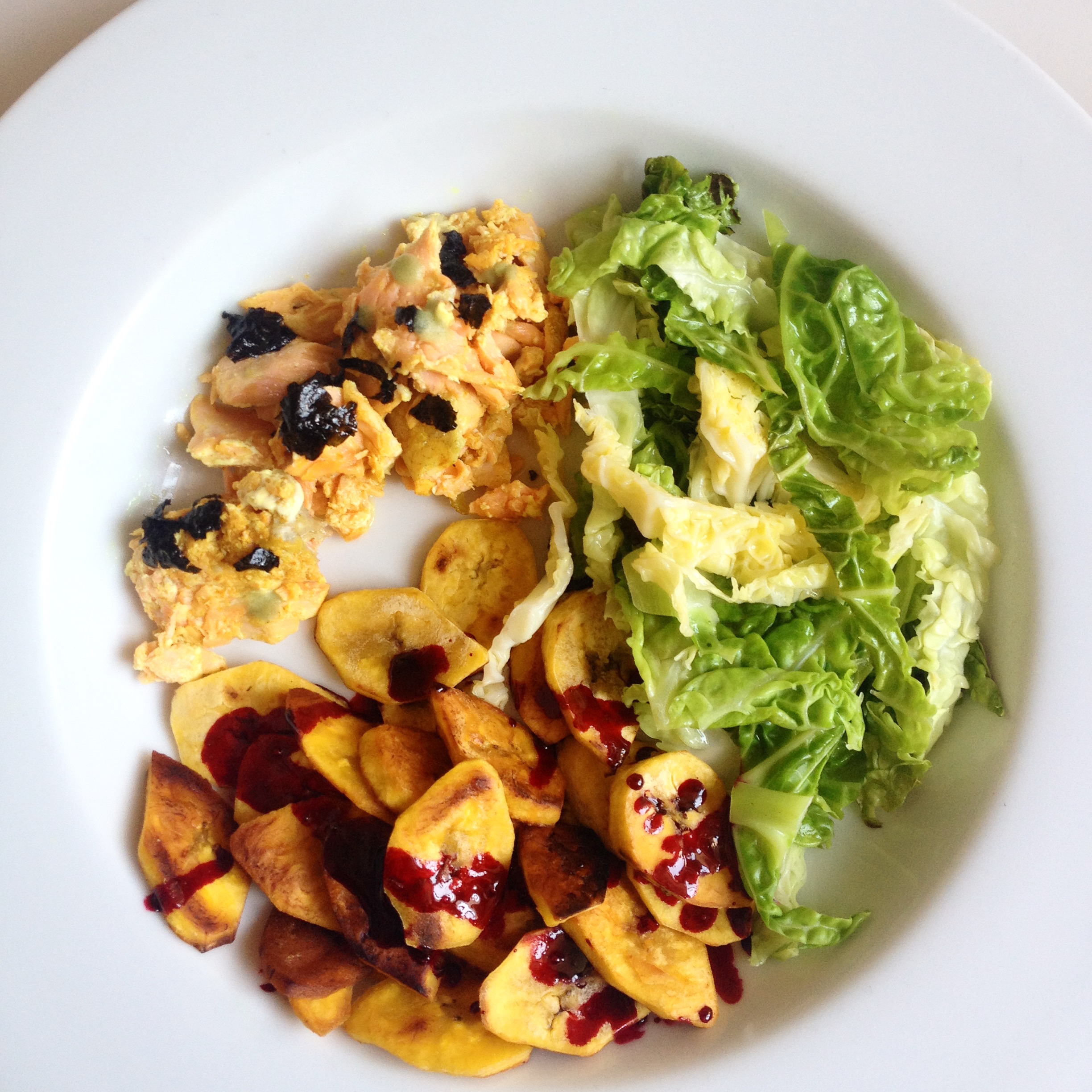 Wild Salmon Topped with Seaweed and Wasabi; Plantains Covered in a Beet Reduction Sauce and Steamed Cabbage