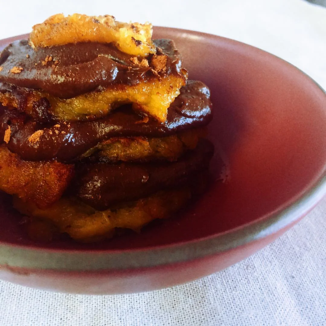 Chocolate Mousse layered between tostones. 